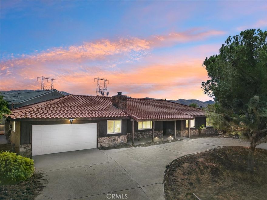 Welcome home to Arcadia Avenue, located in the fast growing city of Hesperia! This single story home features: Almost 1900 sf. of living space; 3 spacious bedrooms and 2 full bathrooms; Formal entryway that flows into the formal living room, family room with rock fireplace, dining room, and kitchen; The kitchen has wood cabinetry, tile counter tops, and black appliances. Off the back of the home is approx. 500 sf. of covered patio! Bonus features include: Tile roof, central HVAC, upgraded carpeting and laminate flooring, oversized 2-car garage with storage cabinetry and washer/dryer area, additional oversized storage shed, and so much more! You will love the corner lot, circular driveway, secondary driveway, RV parking, views, & more! Don't wait, this amazing deal isn't expected to last long at this stellar price! Be sure to scroll down under "features" and checkout the virtual walk through and video!