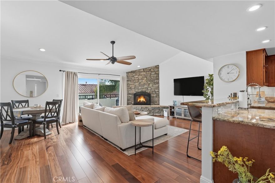 Remodeled townhome blocks from the beach and pier offering nearly 2,000 sq. ft. of thoughtfully designed living across three levels. Step inside through the private gated courtyard and enter through the private gated front patio.

The main entry level features two bedrooms—including the primary suite—and two full ensuite baths. Head downstairs to find a third bedroom, although with no window, is spacious with it's own closet. This level also has direct access entry to the two-car garage with side-by-side washer and dryer hookups. Upstairs on the top floor, the open-concept living area is filled with natural light, vaulted ceilings, and a custom stone fireplace. The chef’s kitchen has been fully upgraded with custom cabinetry, granite counters, stainless steel appliances, and a breakfast bar. An effortless floor plan flowing seamlessly from the kitchen into the separate dining room and living spaces. From the top floor balcony, unwind and soak in the breeze while enjoying the city lights and peek-a-boo ocean views. With enough space for a bbq, this is effortless guest entertainment.

Extensive updates throughout include Brazilian Tigerwood flooring, plantation shutters, remodeled baths, custom stair railings, new windows and doors, upgraded electrical, water filtration system, and a motorized awning for shaded outdoor living.

With only six homes in this boutique community, you’ll enjoy both privacy and convenience, and the coastal dream of living a short distance to the sand, restaurants, and shops, with award-winning Redondo schools just around the corner. Low HOA fees $293.80/mo.