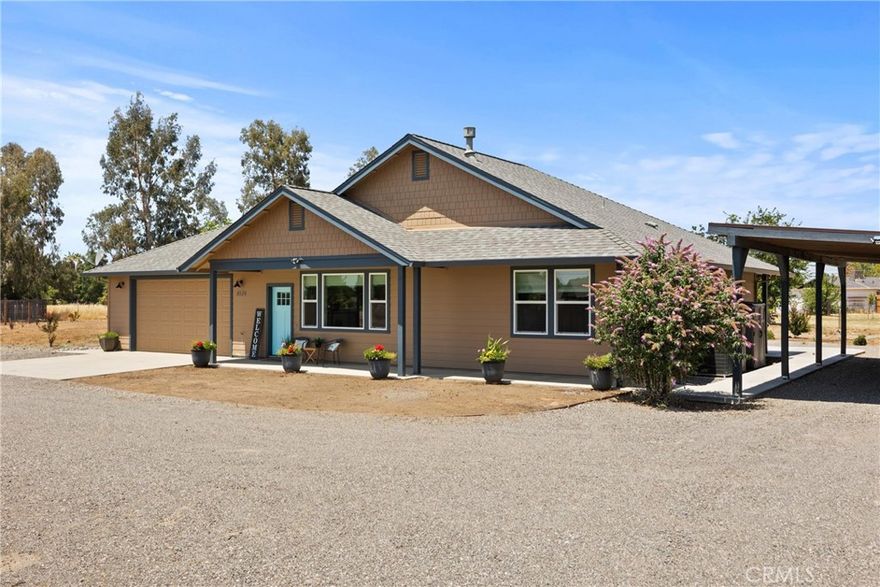 Where do we even begin with all the amazing features this property has to offer!? Nestled on over 2 fully fenced acres at the end of a peaceful cul-de-sac, this newer custom-built 3-bedroom, 2-bathroom home is truly something special. With privacy, space, and style, it checks all the boxes—and then some! This home is as efficient as it is beautiful, featuring OWNED SOLAR for long-term savings and peace of mind. Out back, a brand-new swim spa awaits—perfect for relaxing or cooling off on warm days—surrounded by a multi-level deck and outdoor entertaining area designed for unforgettable gatherings. Whether you're soaking under the stars or hosting a summer barbecue, this space is built for memories. The property also boasts a covered carport with built-in storage that spans the length of the structure, doubling as an ideal entertainment space or extra parking for toys and equipment. The flat, usable land offers limitless potential—bring your horses, 4-H animals, or dreams of a shop, ADU, barn, or arena to life. And with a subdividable lot, you even have the option to build a second home or sell off the extra parcel. And not to mention it is in the Los Molinos Irrigation District with the potential to flood irrigate. Inside, the home is full of warmth and custom touches. The open floor plan welcomes you with a cozy gas fireplace, while the kitchen shines with granite countertops, a large center island, and elegant finishes. The primary suite is a true retreat, featuring tall windows, a stunning floral accent wall, a large walk-in shower, and a spacious walk-in closet. Each room has its own unique personality, giving the home charm and style you won’t find anywhere else. This home feels like your favorite Airbnb getaway—but it’s yours to enjoy every day. A rare blend of luxury, country living, and endless opportunity—don’t miss your chance to own this one-of-a-kind property!