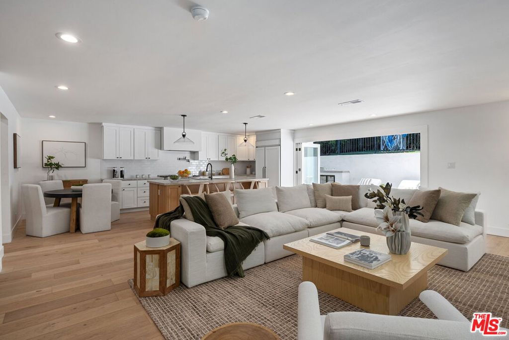 Spanning 4,000 square feet, this newly renovated Cheviot Hills residence blends modern luxury with everyday comfort. Featuring five spacious bedrooms, a versatile den, and five designer bathrooms, this home offers room for everyone - and every occasion. An open-concept layout enhances the sense of space, connecting living, dining, and entertaining areas with seamless flow. The chef's kitchen is a showstopper, complete with high-end appliances, sleek countertops, and a large center island - ideal for both gourmet cooking and casual gatherings. Retreat to the main suite, a true sanctuary boasting dual walk-in closets and a spa-like bathroom with a soaking tub, heated floors, and premium finishes. Outside, the beautifully landscaped grounds extend your living space with private, tranquil areas perfect for relaxing or entertaining. Located in the prestigious Cheviot Hills neighborhood - with access to top-ranked Overland Avenue Elementary - this exceptional home offers the perfect blend of convenience, charm, and upscale living. Homes of this caliber in Cheviot Hills rarely come available. Don't miss your opportunity to make it yours.