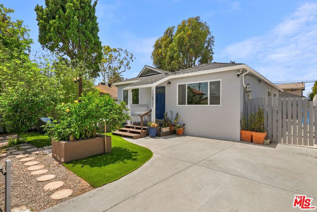 Welcome to your ideal Del Rey retreat! This charming 3-bedroom, 2-bath California bungalow perfectly blends classic character with fresh, coastal energy. Inside, you will find an open-concept kitchen which is equipped with an abundance of counter space and storage, flows right into the living and dining spaces, making it easy to host, relax, or just enjoy the ocean breeze that floats through the updated windows. The original hardwood floors have been beautifully refinished. The spacious light-filled primary bedroom offers a peaceful escape, while the thoughtful updates throughout the home keep things light, bright, and inviting. Outside, your personal oasis awaits complete with a sunny front and back yard, and even your own Fuji apple and Meyer lemon trees. (Homemade pies and fresh lemonade, anyone?) The detached garage equipped with laundry and a half bathroom has been transformed into a versatile workspace and storage area, giving you room for all your creative projects and hobbies. Upgraded throughout, this home has been thoughtfully and meticulously maintained over years. Located on one of the friendliest streets in town, where neighbors know your name and the annual block party is a highlight of the year, this home truly feels like community. Plus, you're just moments from the highly-rated Short Avenue Elementary School, Ocean Charter, local shops, restaurants, and of course, the beach and marina itself. Come live the Marina Del Rey lifestyle where every day feels a little lighter, a little brighter, and a lot more fun.