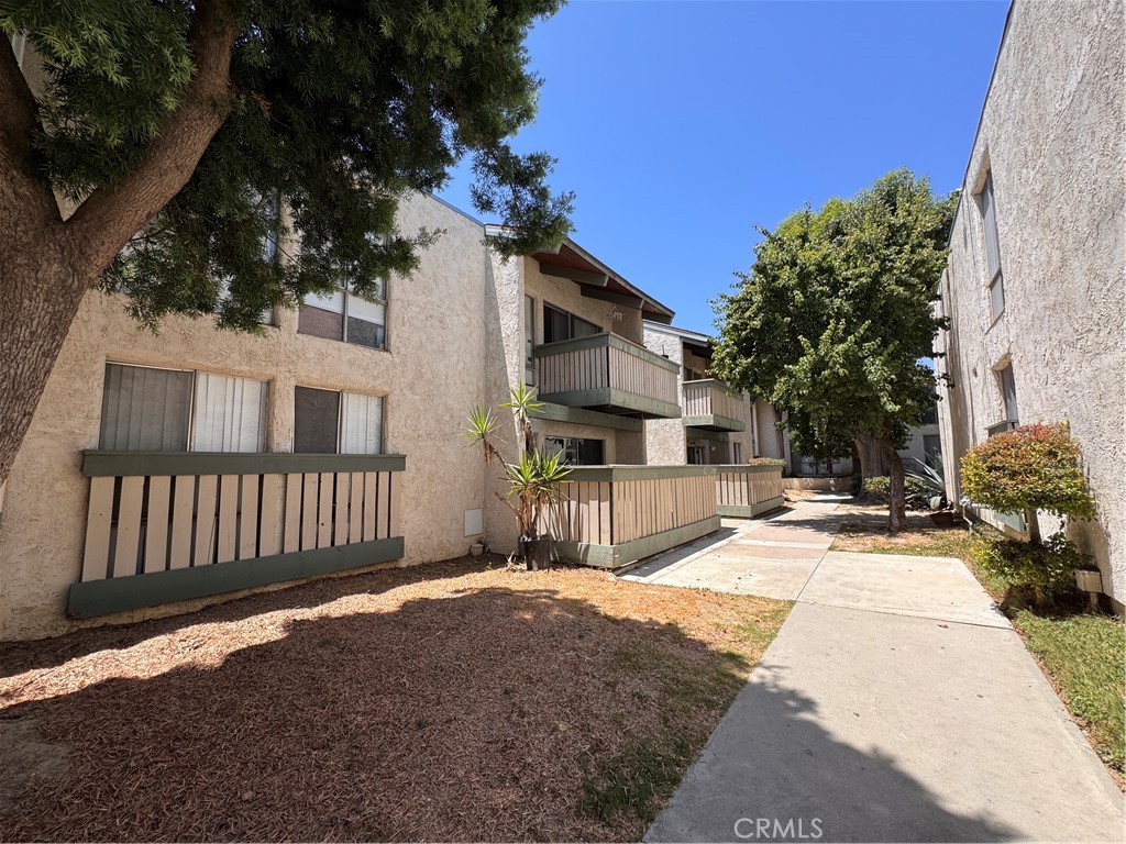 Welcome to this ground-floor condo in the desirable Village Park community, offering 3 bedrooms and 2 bathrooms with a spacious open floor plan. The updated kitchen features granite countertops, rich maple cabinetry, and tile flooring throughout most of the home. A large sliding glass door leads to an oversized private patio with views of the pool and spa—perfect for summer entertaining. The layout includes a primary suite with a full bath, plus two additional bedrooms sharing a second full bathroom. With great natural light and some room for cosmetic improvements, this home offers both comfort a
