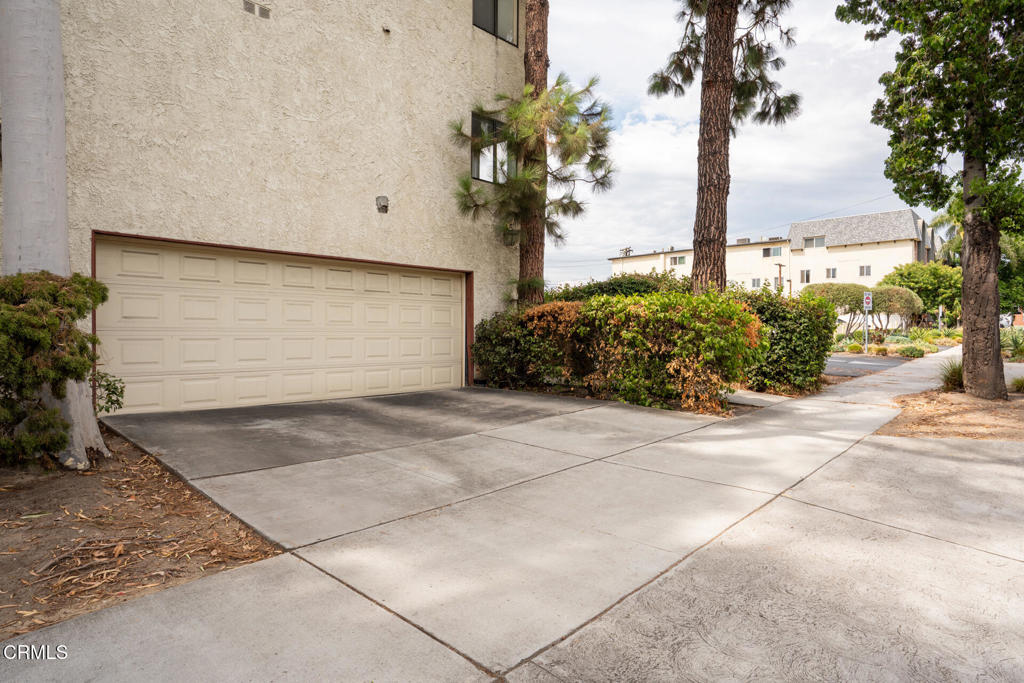 This spacious, remodeled two-bedroom, two-bath condominium is in the heart of Glendale. This unique home includes a private, detached two-car garage and a private driveway, accommodating a total of four cars. It is steps away from Glendale's best shopping and dining options.The entry foyer and guest closet invite you into this one-level home with wood laminate flooring throughout. The great room concept offers flexible living with a breakfast bar in the kitchen, opening to large, open spaces bathed in natural light from multiple windows and a slider leading to a private balcony terrace. The kitchen boasts quartz counters with ample workspace, plenty of cabinets, a breakfast nook, and a laundry closet. Both bedrooms feature walk-in closets, with the primary suite having its own bath.Nearby amenities include Highlight Coffee, Americana, Whole Foods, a new Erewhon (coming soon), and a multitude of multicultural shops and dining. This fantastic condo offers everything you want and need in a vibrant location.