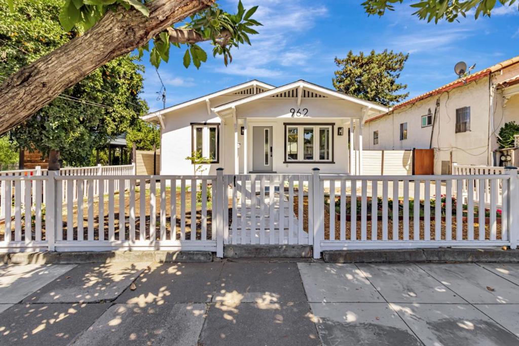 (Property is Virtually Staged). Welcome to this charming 4-bedroom, 2.5-bathroom home located close to downtown San Jose and San Jose State U. With a generous 1,484 sq ft of living space, this residence offers a blend of comfort and functionality. It can easily be used either as a home for the family, or as a home plus rental space for additional income. The kitchen is a standout feature, boasting quartz countertops, an island, built-in oven range, and gas cooking.The living area is inviting and comfortable. The new flooring throughout the home is both enhancing and easy to maintain. Laundry is conveniently located inside with both a washer and dryer. Ideal for families, this home offers a harmonious blend of practical living spaces and desirable features in a prime San Jose location. Completely remodeled and updated with permits. New kitchen appliances, new furnace, new roof, new tankless water heater, new flooring, new paint, new bathrooms and a new large detached 2 car garage (with a separate bath of it's own). Long driveway that will easily accomodate multiple cars or large vehicles. The home has many possibilites that could house two households. Front of house - 2 bedrooms 1 bath and back of house that can be locked off, 2 bedrooms 1 bath with a separate entrance.
