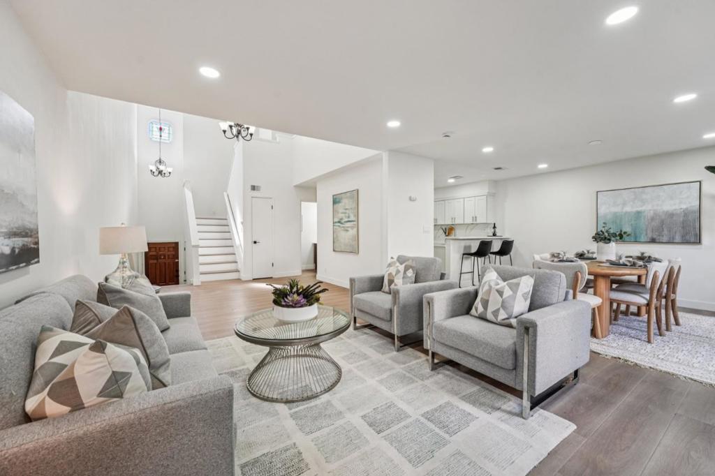 Modern Living in the Heart of Berryessa! Welcome to 1741 Abington Ct a beautifully remodeled townhome offering the perfect blend of style, comfort, and convenience. Step into a grand entryway with soaring 20-foot ceilings and an abundance of natural light. The home features wide-plank luxury vinyl flooring, recessed lighting, fresh designer paint, and contemporary finishes throughout. The kitchen showcases quartz countertops, stainless steel appliances, custom cabinetry, and an ideal layout for cooking and entertaining. Upstairs, the spacious primary suite includes an updated en-suite bathroom and generous closet space. All bathrooms feature sleek tile work, modern vanities, and updated fixtures. Enjoy your own private patio, in-unit laundry, and a two-car attached garage. Located in a peaceful, tree-lined community with easy access to major tech campuses, VTA Light Rail, BART, and freeways 880, 680, and 101. Close to shops including Ranch 99 HMART and Costco. beautiful parks, and top dining spots this is Berryessa living at its best!