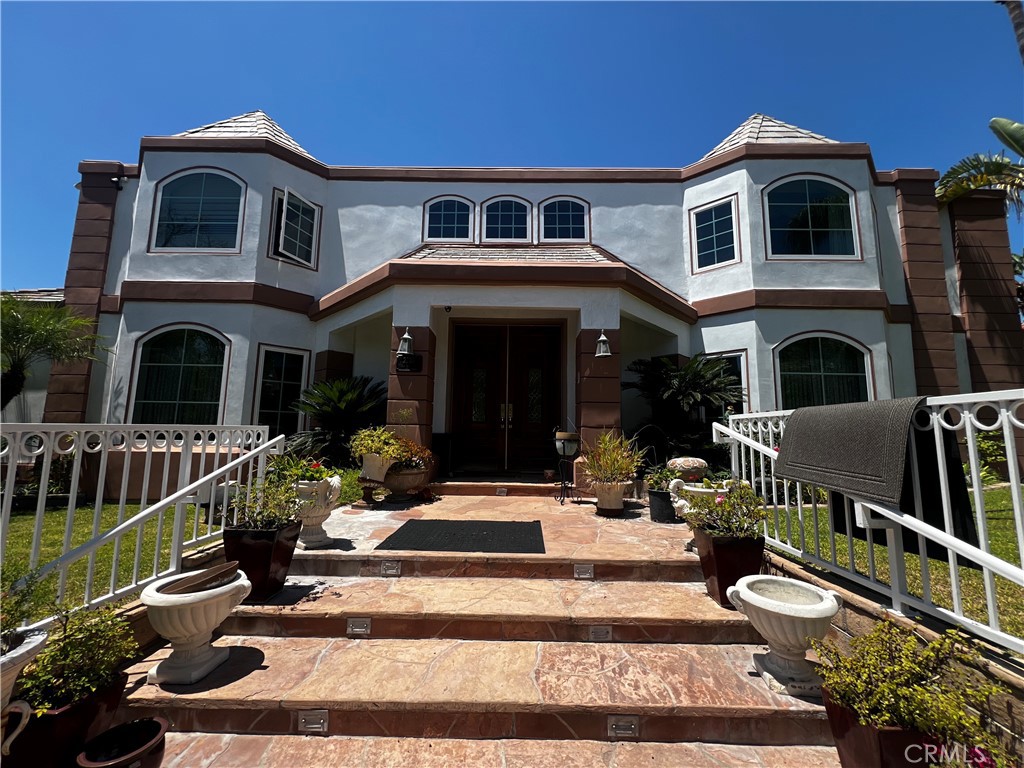 Luxury Living with Breathtaking Views – 7-Bedroom Estate in Orange Hills.
Welcome to 2720 N Villareal Dr, a one-of-a-kind custom estate perched in the prestigious hills of Orange, offering panoramic views of the city and unmatched privacy. This expansive residence features 7 spacious bedrooms and 7.5 luxurious bathrooms, designed with refined elegance and comfort in mind.
Step inside to discover soaring ceilings, grand living spaces, and high-end finishes throughout. The gourmet kitchen is a chef’s dream, complete with premium appliances, custom cabinetry, and an oversized island perfect for hosting.
The highlight of this remarkable property lies outdoors—your own private resort-style backyard featuring a custom-designed pool with spa, full-size basketball court, and multiple entertainment areas, all set against a stunning backdrop of city lights and sunset views.
Each bedroom is generously sized, with several featuring en-suite bathrooms and private balconies. The primary suite offers a true retreat with a spa-like bath, walk-in closet, and sweeping views of the valley below.
Additional amenities include a 3-car garage, large driveway, beautifully manicured landscaping, and a layout that easily accommodates multi-generational living or guests.
Located in a coveted neighborhood near top-rated schools, fine dining, and hiking trails, this estate offers the best of Southern California luxury living.
Don’t miss this rare opportunity—schedule your private showing today!