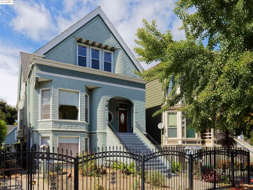 Welcome to 1033 Magnolia Street, a remarkable West Oakland property featuring two homes on one expansive lot. The front residence, a grand Victorian built in 1890, beautifully showcases the craftsmanship and architectural detail of its era while offering the flexibility of four individual units. The main home includes two 1-bedroom units on the ground floor, one 1-bedroom flat on the middle level, and a 2-bedroom owner’s unit occupying the top floor. The owner’s unit has been recently renovated with designer light fixtures, new appliances, stylish countertops, plush carpeting, and a fully updated bathroom. Thoughtfully staged, this elegant space highlights the perfect balance of historic charm and modern comfort — ideal for an owner-occupant or as a showpiece rental. At the rear of the property sits a detached cottage, currently under renovation, offering potential as an additional income unit, private guest house, or creative studio space once complete. Located in the heart of West Oakland, this property combines vintage character with exceptional investment potential. Its close proximity to downtown Oakland, public transit, and the vibrant dining and arts scenes of Uptown and Jack London Square make it a truly special opportunity for both investors and owner-occupants alike.