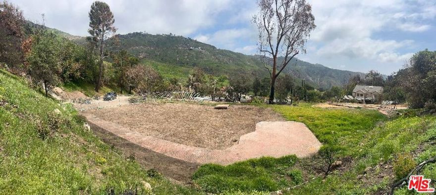 Amazing Fire Rebuild 1.3-acre lot in the prestigious Sea View Estates community. Located only 5 minutes from PCH and ocean, this property has a large flat graded building site with beautiful mountain views and partial ocean views of the Santa Monica Bay. Save hundreds of thousands of dollars with easy to obtain fire rebuild permit process an existing septic system, graded pad, driveway and more. Previous home was 3162 sq.ft per tax assessor records with four bedrooms and three bathrooms. The property is one of the largest in the community and offers tremendous investment opportunity with homes selling in area for over $3,000,000. Located minutes from Malibu's beaches, trailheads, the Malibu Country Mart and easy access to Valley too. By far the best priced fire rebuild lot on the East side of Malibu or Palisades!