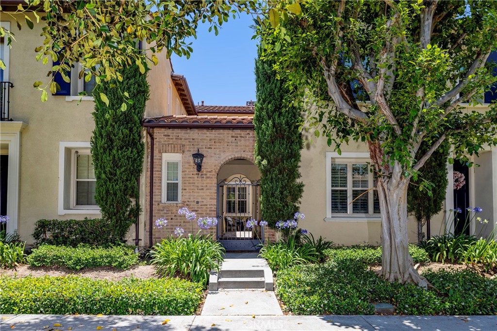 Welcome to this beautifully refreshed 3-bedroom, 3-bathroom townhome in the highly sought-after Woodbury community of Irvine! Offering 1,808 square feet of thoughtfully designed living space, this home seamlessly blends comfort, style, and convenience. Recently updated with brand-new flooring and fresh paint throughout, it’s move-in ready and waiting for you. Step into the open-concept kitchen, where soaring vaulted ceilings, stainless steel appliances, and ample cabinetry create a perfect space for both everyday living and entertaining. The adjacent living area features a cozy fireplace—ideal for relaxing evenings at home. Upstairs, the primary suite offers a tranquil retreat complete with a charming Juliette balcony and a dual vanity “his and hers” layout, providing space and privacy. Enjoy outdoor living in the serene private courtyard, enhanced by a soothing fountain—perfect for morning coffee or evening gatherings. Additional highlights include a spacious two-car garage with an EV charging outlet and energy-efficient LED lighting throughout. As a resident of Woodbury, you’ll enjoy access to exceptional community amenities, including tennis and pickleball courts, basketball courts, and a resort-style pool. All this, plus the added benefit of being located within the award-winning Irvine Unified School District, known for its academic excellence. Don’t miss out on a chance to own a home in one of Irvine’s most desirable neighborhoods