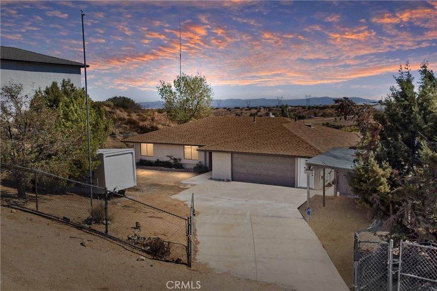 Updated 3-bedroom, 2-bathroom home with attached 2-bedroom, 1-bath ADU on 1.07 acres with hillside and desert views. The main home features laminate wood flooring, recessed lighting, and a remodeled granite kitchen with stainless steel appliances, walk-in pantry, and breakfast nook open to the family room. Family room offers recessed lighting, wood-burning fireplace, and sliding door access to the rear covered patio and fenced yard.



Primary suite includes a large walk-in closet, ceiling fan, and remodeled bath with dual granite vanities, tiled walk-in shower, soaking tub, and skylight. Two additional bedrooms feature ceiling fans and share a full bath with granite vanity and shower/tub combo.



Attached ADU (converted garage) includes its own separate entrance, kitchen area with sink, spacious living area, two bedrooms with ceiling fans, full bath with tiled walk-in shower, and laundry hookups.



The property is fully fenced with a covered front carport, usable lower area with chicken coop, and plenty of open space for future use. Conveniently located with beautiful natural views, this home offers versatile living and move-in-ready updates.