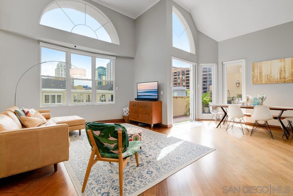 Stunning top floor residence at The Watermark, an elegantly appointed mid-rise boutique building in the Marina district of Downtown. Soaring 15-foot ceilings bathe the interior in natural light and welcome you into this spacious, bright & peaceful residence. The unit features a completely remodeled kitchen w/ custom soft-close cabinetry, stainless steel GE appliances, Cesarstone countertops, a motion-sense touchless faucet, built-in reverse osmosis water filtration system, under cabinet & cove lighting, solid brass cabinet hardware imported from England. Hardwood flooring in the main living areas adds warmth & character. An enhanced floor plan features dual primary suites located on opposite ends of the apartment with updated bathroom vanities & fully tiled shower/tub enclosures. Spacious bedrooms offer expansive 10-foot ceilings, walk-in closets and a truly serene atmosphere. Enjoy the gorgeous San Diego weather on your private, spacious & sun filled patio w/ eastern views into downtown & beyond. Other features include motorized window shades throughout, a sizable laundry room, and two side-by-side parking spaces in the secured underground garage. The Watermark is a highly coveted residential building and top floor units rarely come on the market. Don’t miss this RARE opportunity to enjoy refined urban living at its best! Watermark is one of the top residential developments in the Marina District of downtown San Diego, offering a unique blend of sophistication and charm. This boutique mid-rise, offers just 96 well-appointed residences, concrete & steel construction, full-size parking, and exceptional common facilities. The building's design includes spacious courtyards and a 5th floor dedicated entirely to amenities (full gym, stylish clubhouse, and a rooftop deck with panoramic city, park, and bay views). Watermark stands apart from typical high-rises, offering a tranquil escape from the downtown bustle while keeping you steps from San Diego’s best— you will relish being just a short stroll away from the scenic Waterfront Park, the open air shops at the vibrant Seaport Village and the Headquarters, Rady Shell at Jacobs Park (summer home of the San Diego Symphony) and the new Research and Development District (RaDD) on the Embarcadero. Enjoy all that downtown has to offer, just outside your doorstep. This residence is more than just a condo, it's a gateway to the city's vibrant lifestyle, ideal for discerning buyers seeking something truly special. With pride of ownership throughout, Watermark feels like home. Schedule a viewing today and start living the Downtown lifestyle.