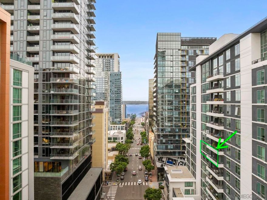 Located in the heart of vibrant Little Italy, this south-facing condo on the 10th floor of Acqua Vista offers the ultimate urban lifestyle. One of the few residences in the building to include a 4' x 12' deeded storage space in the parking garage, this home combines convenience, functionality, and style. Floor-to-ceiling windows bathe every room in natural light and frame sweeping city views, creating a bright and inviting atmosphere.  The open-concept layout features a spacious kitchen with an eat-at bar that flows seamlessly into the dining and living areas—perfect for entertaining or everyday living. Just off the living room, a large private patio overlooks the city and bay, providing an ideal spot for morning coffee or evening relaxation. Both bedrooms are generously sized, and the home includes in-unit laundry, one assigned parking space, and the bonus of the extra storage space.  The Acqua Vista building was recently remodeled and offers an impressive collection of resort-style amenities: valet parking, an 8th-floor rooftop pool and spa, fire tables, a BBQ area, a fitness center, EV charging stations, Amazon lockers, a package room with perishable notifications, full-time security, 24-hour concierge staff, and an on-site HOA manager. Aqua Vista is also a VA-approved community!  All of this is just steps from award-winning restaurants, cozy coffee shops, the scenic waterfront, and the renowned Little Italy Farmers Market. Whether you’re searching for a full-time residence, a stylish second home, or a prime investment opportunity, this condo delivers an unbeatable combination of location, amenities, and value.