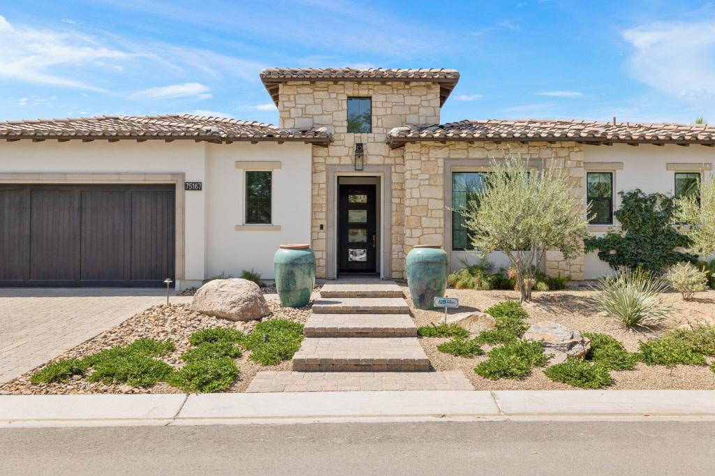 Welcome to The Province community, located in the heart of Indian Wells. This stunning GHA Collection Plan 2 home offers luxury desert living at its finest. Boasting 4 bedrooms, including a rare casita with a living room option (only 2 homes in the community feature this layout) an office and 4.5 bathrooms. Completed in 2023 with exceptional attention to detail, this residence is designer finished and being sold fully furnished and stocked, a true turnkey opportunity. Notable features include an owned 37-panel solar system, Tesla Powerwall, three ovens, two dishwashers, a custom-designed fireplace, bar, fire pit, second laundry, security system, built in sound system and an outdoor kitchen complete with cooktop, pizza oven, sink, and storage. From a thoughtfully designed interior to premium outdoor amenities, every element of this home reflects quality, craftsmanship and a refined sense of style, all within the gates of The Province.