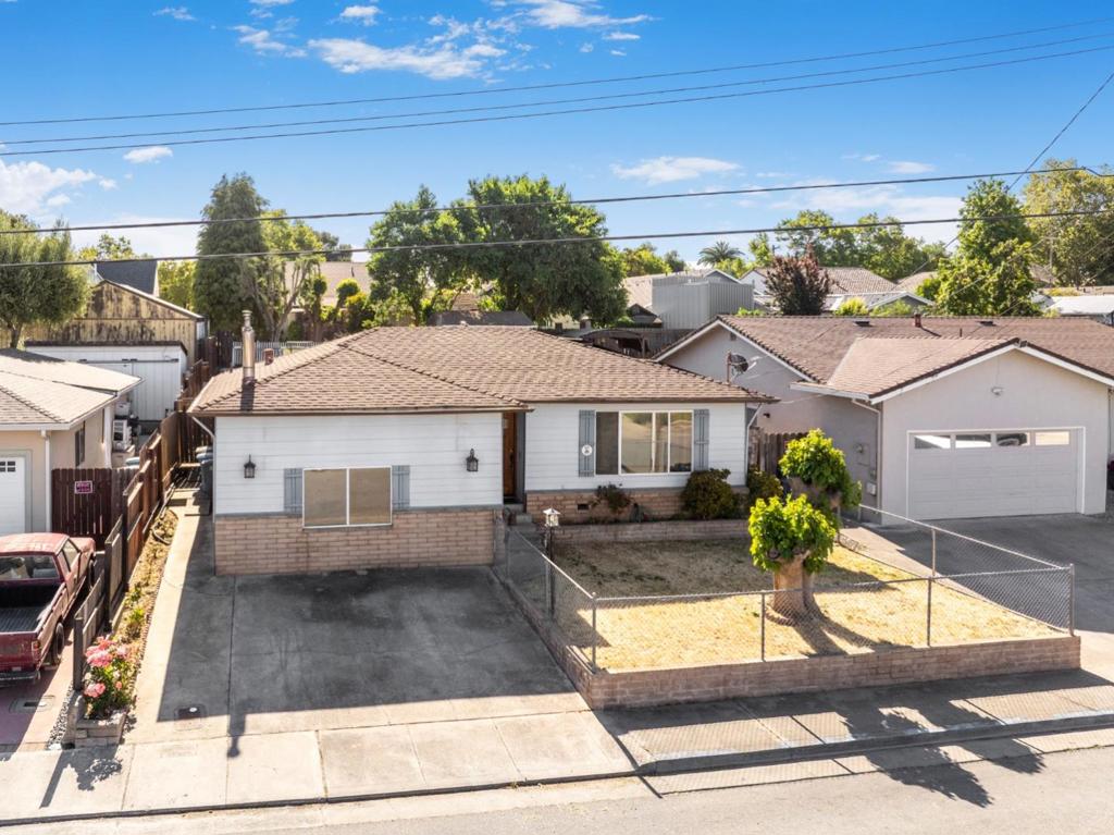 Welcome to 921 Suiter St a 4-bedroom, 2-bathroom home offering approximately 1,672 square feet of comfortable living space on a generous approximately 5,001 square foot lot. Perfectly located near the heart of Downtown Hollister, this property offers easy access to local restaurants, boutique shops, and the vibrant weekly farmers market. Step inside to find a spacious and functional layout ideal for both everyday living and entertaining. The kitchen flows seamlessly to a large covered patioperfect for outdoor dining, weekend barbecues, or simply enjoying your private backyard retreat year-round. Additional highlights include a paid-off owned solar system, providing energy efficiency and long-term savings, and a low-maintenance lot that offers space for gardening, pets, or play. Dont miss this opportunity to own a home in one of Hollisters most convenient and charming neighborhoods. Schedule your private showing today!