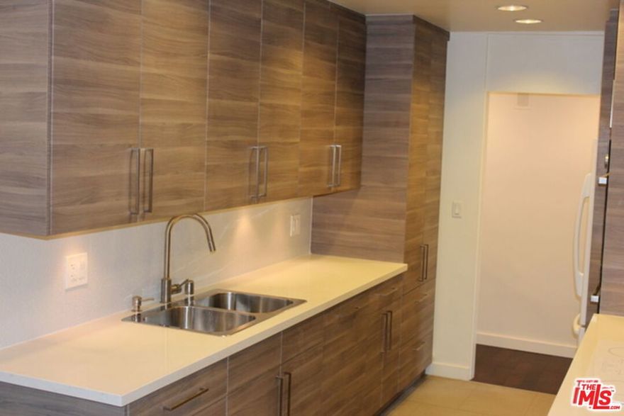 Exciting opportunity to lease in the heart of Westwood near UCLA.  This front facing remodeled condo offers Master bedroom suite + guest bedroom suite.  Both bathrooms have been remodeled.  The over-sized living room opens to a very large covered terrace with an outlook to the street.  The condo also features an updated kitchen with newer appliances including double oven and cesarestone counters.  There is an adjacent dining room area and polished dark wood floors throughout.  The large master bedroom with ensuite bathroom has both tub, shower & ceserstone counter. There is also in-unit stack washer/dryer. This is a  secured building and unusual to this building are 2 side by side parking spaces on the first level of the gated subterranean garage.  Fantastic location, close to shops, restaurants, UCLA, easy freeway access.  Lovely move-in condition and available July 1.