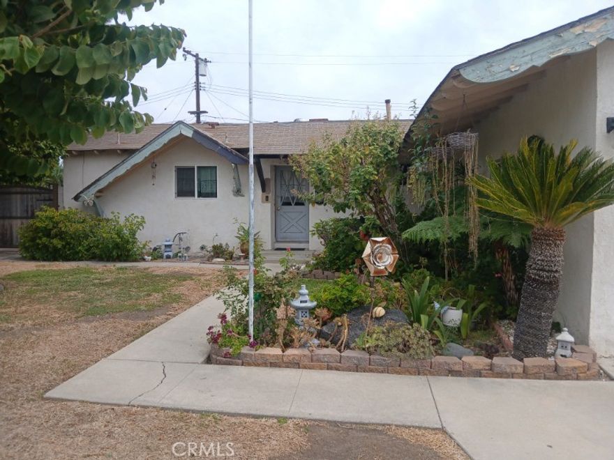 Welcome to this beautiful property. Tucked away at the end of a peaceful CUL-DE-SAC in the largest home in the area. Four large bedrooms, great for two families, large closets, 2 master bedrooms, 2.75 baths, Central AC and a fireplace in the living room. Large backyard with many mature fruit trees, ideal for entertaining and future ADU. House needs some TLC, giving you the perfect opportunity to customize it to your style.