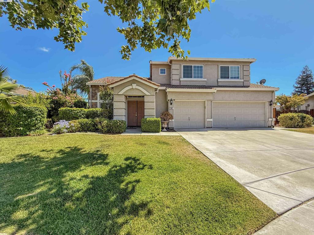 Welcome to Tracy! This expansive home has 4 bedrooms and 2 1/2 bathrooms with the primary bedroom and bathroom (including a walk in closet and dual sinks) on the 1st floor. The tiled entry leads to a living room with a dining area while the family room has a gas fireplace with a TV alcove and the kitchen includes an island and breakfast nook. A half bathroom and downstairs laundry room complete the 1st floor. The loft sits atop the stairs on the 2nd floor which includes 3 additional bedrooms, a bathroom, and a hallway with built in cabinets. The entire interior has been re-painted and new carpet has been installed throughout the home. The backyard includes a patio, side yards, a storage shed and a new fence around the entire perimeter of the property. The attached 3 car garage has automatic garage door openers and an exterior door leading to one of the side yards. NOTE: some pictures are virtually staged and the total room count is estimated.