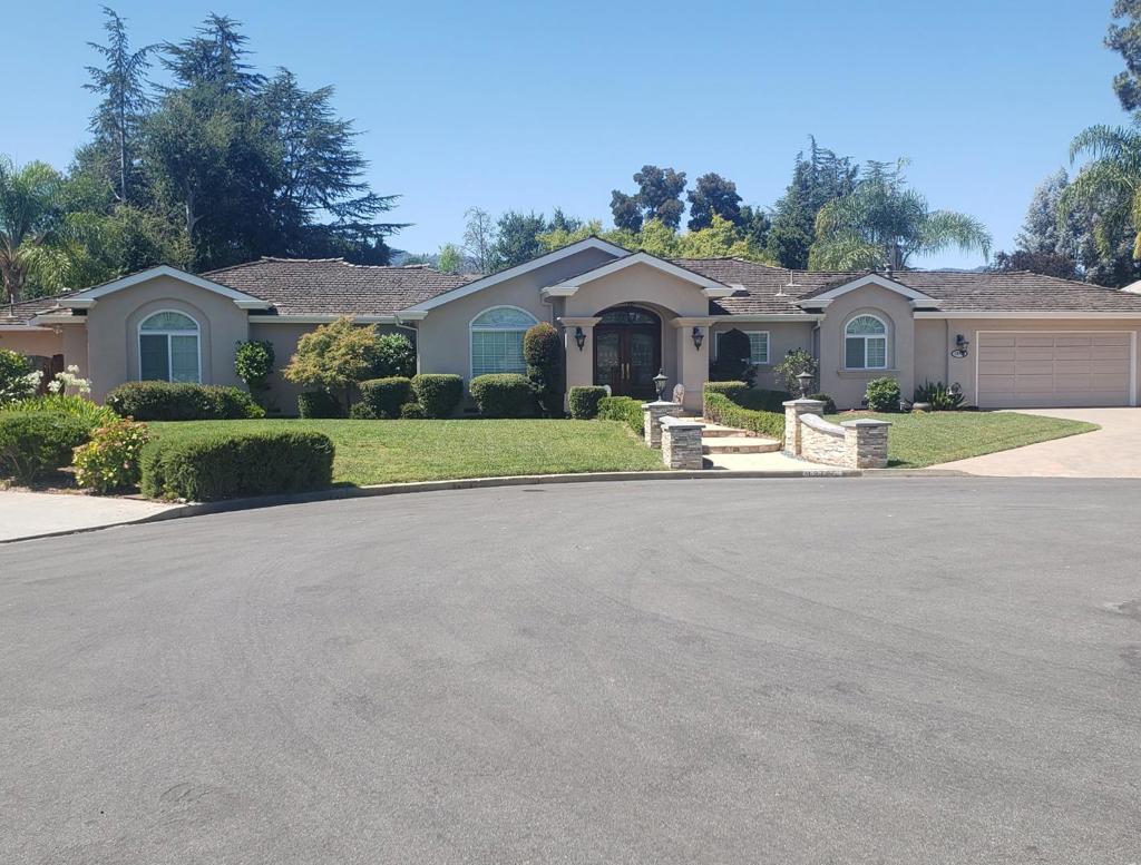 Stunning property with elegant decor and many high-end luxurious materials and amenities. Seller spared no expense throughout. You'll be blown away! Major remodel throughout was done in 2002; Additional remodel/expansion done in 2008, 2017 and 2022/2023. Amenities include: Formal living room with cathedral ceiling; Formal dining room; Gourmet kitchen with custom cabinets, granite counters, stainless appliances, recessed lights, custom glass pendant lighting, Porcelain tile floor and pantry with roll-out drawers. Breakfast area off kitchen has custom cabinetry with lighted display shelves and toe-kick drawers; Spacious TV/Great Room with gas starter fireplace and custom wet bar with granite counter and wine refrigerator; Game/Recreation room; Work-out room. Primary bedroom with gas starter fireplace, French door to backyard and custom wardrobe room; Primary bathroom was remodeled and permit was just finaled; Second ensuite has expanded bathroom with French door for direct access to the backyard; Two additional bedrooms; Hall bathroom was updated in 2022; Half bath/laundry room combo. Backyard is a private retreat with views of the mountains and offers a black-bottom pool, Arizona flagstone decking, custom outdoor kitchen, sport court and pergolas. 2-car garage; Saratoga Schools.