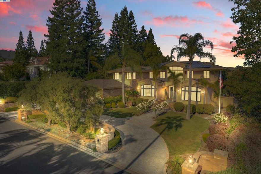 Experience private estate living in one of Danville’s most coveted gated communities. Designed with intention, the home features expansive gathering spaces, an executive office, and seamless indoor-outdoor flow for modern living.  Set on 1.13 acres, the grounds offer a sport court, organic garden, mature landscaping, and a fully equipped outdoor kitchen with a stone dining patio oriented for sunset views. Owned solar supports energy-conscious living, while staffed gates provide added peace of mind. Whether you're entertaining, retreating, or simply recharging—this residence adapts to the lifestyle you lead.