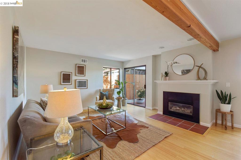 OPEN2-4:30 6/10 & 6/17 Gorgeous, inviting, 2nd floor unit in Mediterranean style building in Grand Lake area. Lovingly maintained unit with homey, spacious & open floor plan. Bamboo floors, fresh paint & fun lighting throughout. Living room boasts dramatic wood beamed ceiling & gas fireplace. Updated kitchen including Bosch appliances & in-unit laundry. Adjacent dining area. Master suite w/updated bathroom featuring new tile floor & vanity w/his and hers sinks. Bonus room w/half bath & built-in murphy bed for guests, office or 2nd bedroom. Private rooftop patio accessed through glass doors from living room. Outdoor space perfect for entertaining & overlooks Grand Ave shops & restaurants. Secure building w/interior access from gated garage which includes deeded parking space plus additional storage. Close to Lake Merritt, Whole Foods & Trader Joes +shops & restaurants on Grand, Lakeshore & Piedmont Ave. Walk score of 91. Easy access to freeways, SF Express Bus, casual carpool & BART.