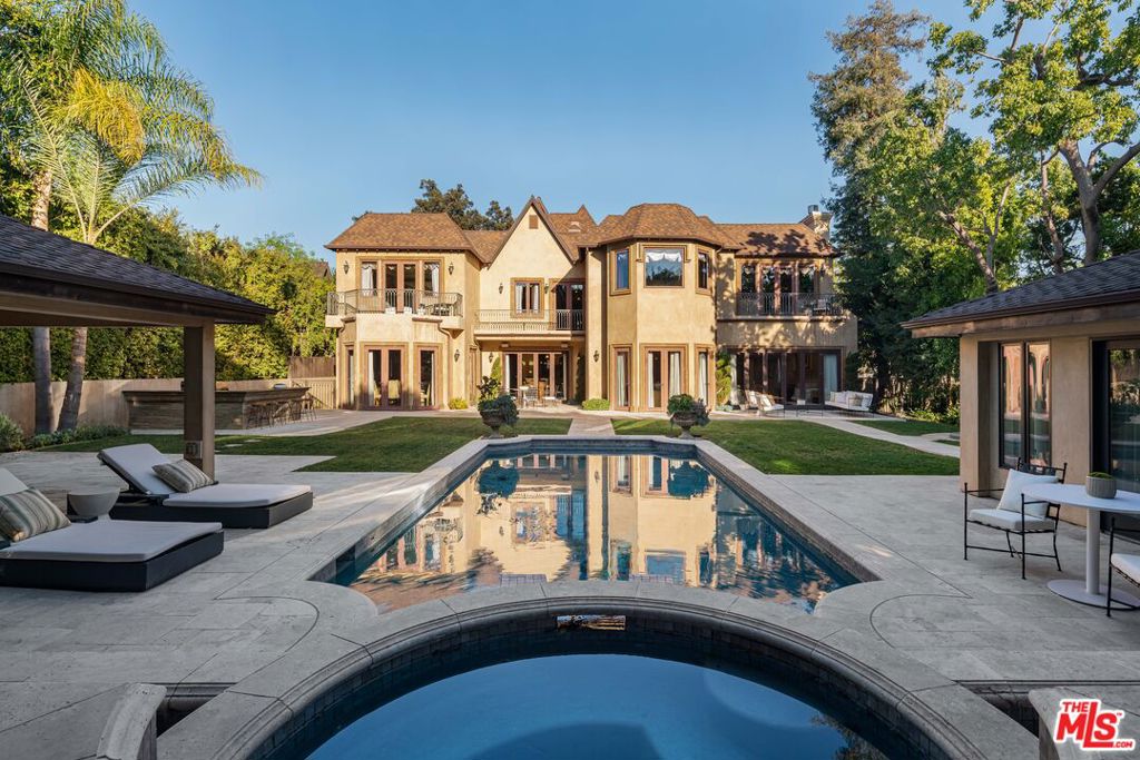 Can be offered furnished for shorter terms. Elegant English Tudor in highly sought after Beverly Hills Flats. Step into timeless sophistication with this beautifully renovated 2011 turnkey estate, situated on one of the most coveted streets in the flats. This exquisite home combines classic Tudor charm with modern luxury, offering the perfect blend of historic elegance and contemporary comfort. Nestled on a serene, tree-lined street in the heart of the Beverly Hills Flats. Meticulous attention to detail, seamlessly integrating modern amenities with period architecture. Generously proportioned living and entertaining/outdoor spaces, including a grand formal living room with a fireplace, a formal dining room, and an open-concept gourmet kitchen with state-of-the-art appliances. Multiple en-suite bedrooms, including a stunning primary suite with a spa-like bathroom and walk-in closets. Generous outdoor grounds with private plush backyard and pool. Moments from world-class dining, shopping, and entertainment in Beverly Hills.Don't miss this rare opportunity to own a piece of refined history in one of the most sought-after neighborhoods.