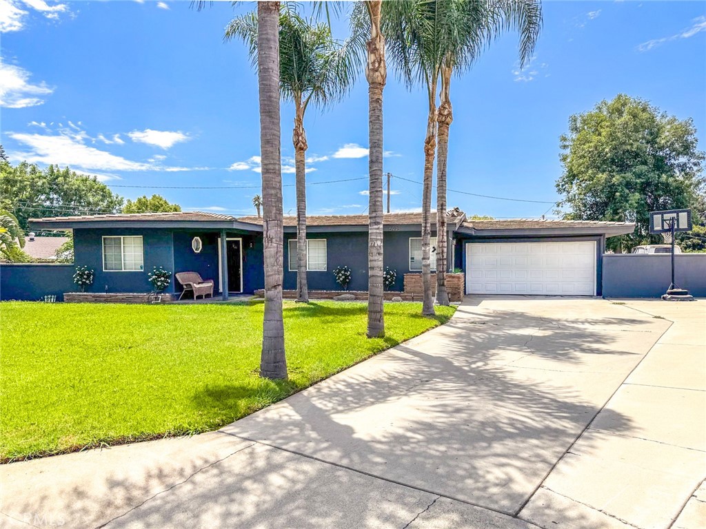 This beautifully remodeled and spacious single-story home is located in a highly desirable area of Riverside on a HUGE lot! Sitting on over 15,000 sq ft, the property offers an expansive grassy lawn with plenty of room to entertain, relax, and BBQ. Listed as a 3-bedroom on tax rolls, the home features an addition that provides 2 extra bedrooms, making it a total of 5 bedrooms and 2 beautifully remodeled bathrooms. The great floor plan includes a large living room with a cozy fireplace and an updated kitchen with abundant cabinet space and stainless-steel appliances. The oversized lot also provides potential RV gated parking, a long driveway with ample space, and a 2-car garage complete with laundry connections and generous storage.