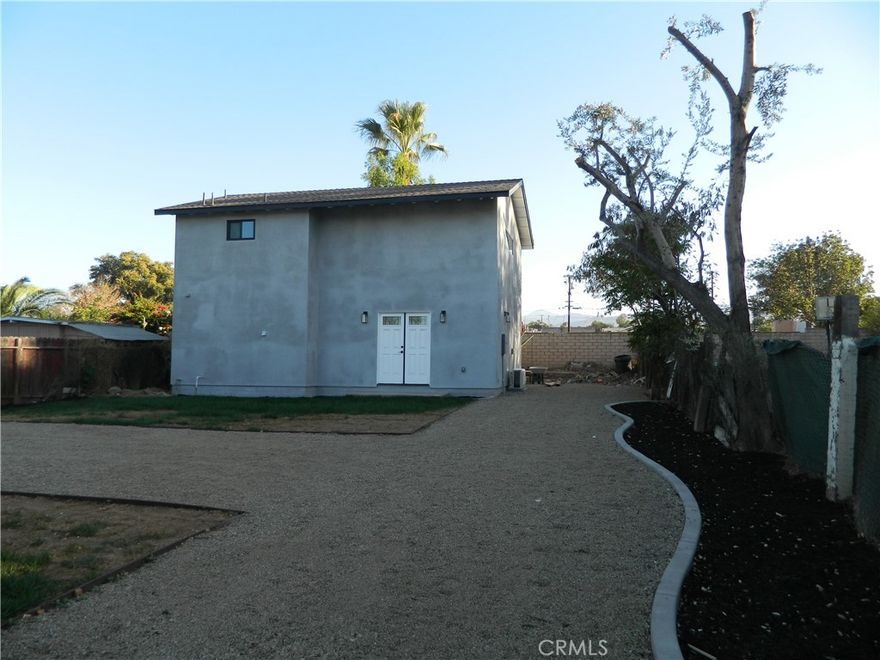 Beautiful two-bedroom two bath home for rent in central Corona area for rent. This home is a new two story ADU with beautiful new kitchen with all appliances included, new vinyl plank flooring throughout, neutral paint throughout, recessed lighting throughout. This home has one bedroom and bathroom on main level, and one bedroom and bathroom on second floor. There is a nice living room area that is open to the kitchen. There is a nice grass area in front of the property with a gravel driveway. This is the back house on a lot with three homes.