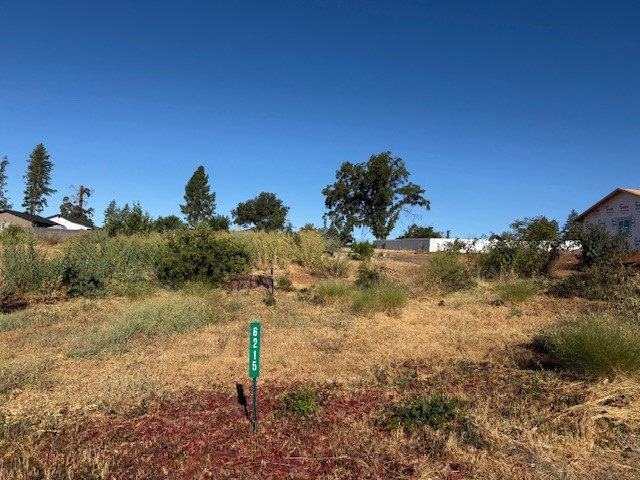Beautiful lot to build a forever home on. As you drive down the neighborhood you will see all the homes coming up around the lot are full of life. The Bille Park is right down the road from the home. This level 34,412 rectangular lot once boast of a beautiful 3/2 home with lush soil that had many fruit trees, one was a huge fig tree that gave fruit continuously. The lot still has the paved driveway and cement stairs that walked up to the home itself. Right after the fire the septic was inspected and confirmed still in working order, buyer to do full investigation. All this large lot needs is for you to come make it home.