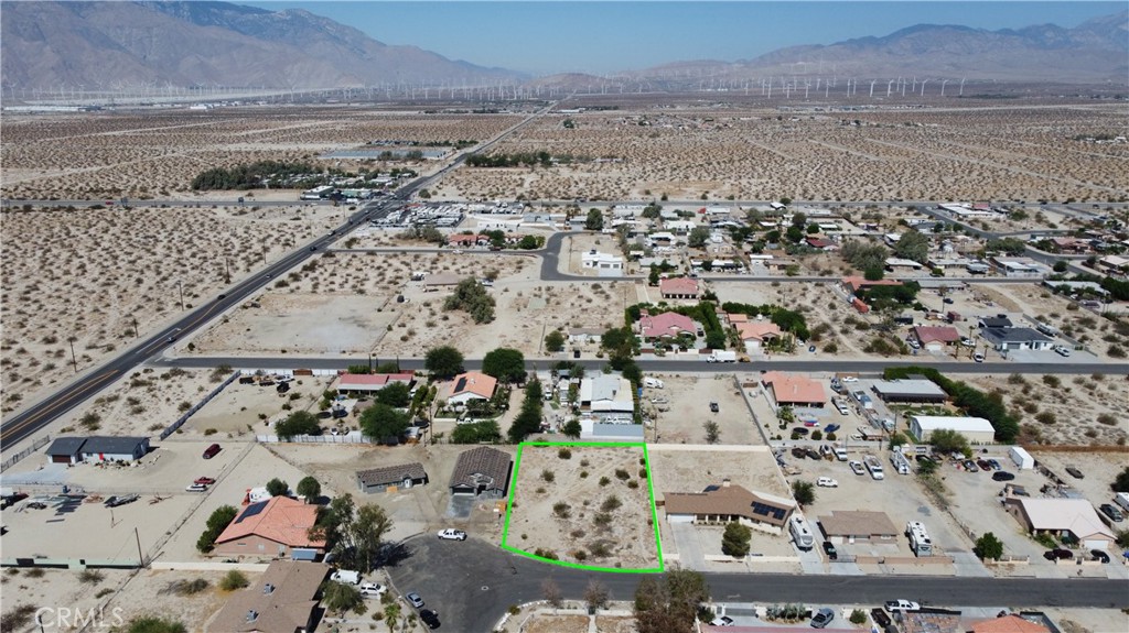 Prime 17,424 sq ft lot in the unincorporated area of Dos Palms. Situated in Desert Hot Springs with versatile W-2 zoning—offering a wide range of potential uses including single-family residential, limited agricultural, and light commercial (buyer to verify). Located on Parcel #657-142-015, this spacious and level lot is a great opportunity for investors, builders, or entrepreneurs looking to develop in a fast-growing community. Enjoy mountain views, serene surroundings, and at short distance to Fwy I-10, close proximity to Palm Springs, Joshua Tree, and the Coachella Valley. Easy access to utilities nearby and paved road frontage makes this lot ideal for building a custom home, vacation rental, or long-term income property. Schools, shopping, and services just minutes away. With Desert Hot Springs continuing to expand and attract development. You can't miss on this property with great potential!