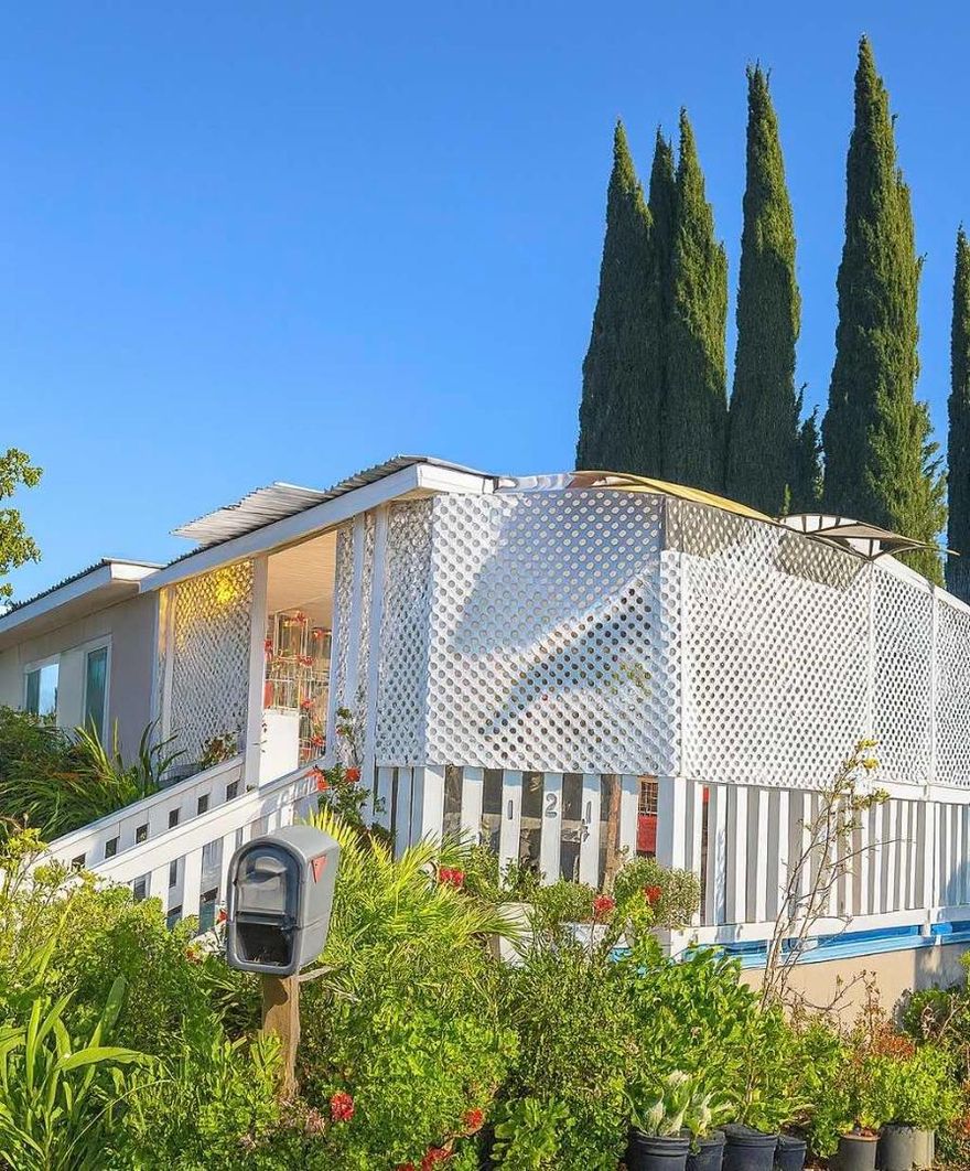 Located in Golden Wheel Mobile Home Park, this home offers 2 beds, 1 bath, plus a bonus room and an additional bath (permit status unknown). Updated approx. 2021 with bathroom upgrades and exterior paint. Seller to include furniture, 2 TVs, newer refrigerator, microwave, washer & dryer. Low space rent approx. $876/month. Carport fits 3-4 cars. Community amenities include a pool and clubhouse. Convenient San Jose location.