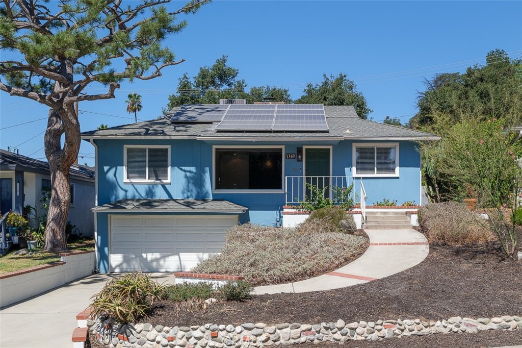 A wonderful spacious mid-century Altadena home situated in a beautiful neighborhood overlooking the tree lined Mount Lowe Park. City Views with a park-like setting all still fully intact. This special home features 2 bedrooms + Den that could be 3rd bedroom along with a bonus room perfect for in- home gym or office along with a bathroom and shower attached to subterranean double garage. There is also “owned” solar panels with huge monthly electrical savings. Other features of this property include, living room with great views and a fireplace, galley kitchen with newer appliances and dining area. Laundry room with fantastic built-in storage/pantry. Separated den with a large closet and built-ins with direct access to backyard. Large primary suite with dressing area with built-ins, sky light and a large primary bathroom with walk-in shower. Hard wood flooring throughout. Tankless water heater. Newer air conditioning and heating unit. Huge private backyard with spacious concrete patio for entertaining large gathernings along with second patio with built-in arroyo stones under beautiful mature trees. Come and see this great house.