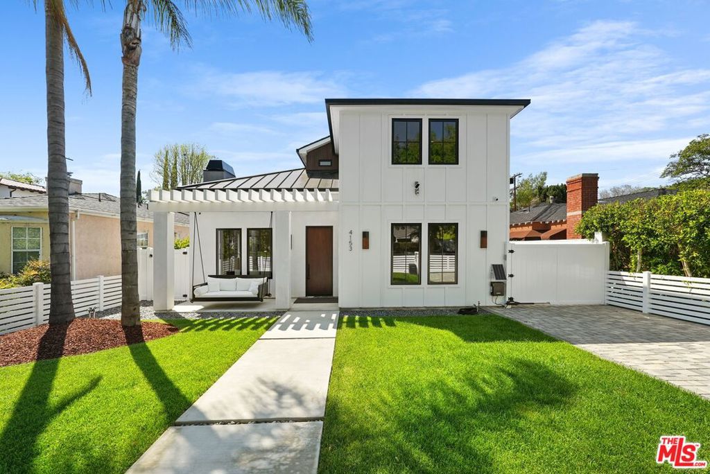 Perfectly located in the Footbridge neighborhood of Studio City and in Carpenter School District is this meticulously crafted 3-level new construction home. The open concept floor plan provides a perfect flow, while wood floors and walnut accents lend sophistication and elegance. Throughout the home are multiple areas to entertain, flowing from the living room with soaring vaulted ceilings through the spacious open dining room and into the family room. The gourmet kitchen boasts Calacutta marble countertops, spacious island with breakfast bar, large SubZero refrigerator, Wolf range & microwave, dual Fisher & Paykel dishwashers, a custom designed wood detailing on the range hood, and a walk-in pantry. Upstairs, the Primary Suite includes a bright and warm bedroom surrounded by windows, spacious walk-in closet, private balcony, and a spa-like ensuite bathroom with soaking tub. Two additional bedrooms, laundry, and a patio round out the upstairs living areas, while one more bedroom with ensuite bathroom and an office are featured on the main level. An expansive basement with a large movie theater further expands the entertaining possibilities, with space for a game room, home gym, and/or additional office. The backyard is a true oasis with a large pool & spa, sundeck, and plenty of space for alfresco dining. The innovative GrassPave driveway ideally serves multiple functions, providing extra yard space and expanding the lush landscaping. Savant smart home technology is fully integrated and triple-zone HVAC adds to the ease of modern living. Located just moments away from all the best shops and restaurants that Studio City has to offer, this property is an opportunity not to be missed.