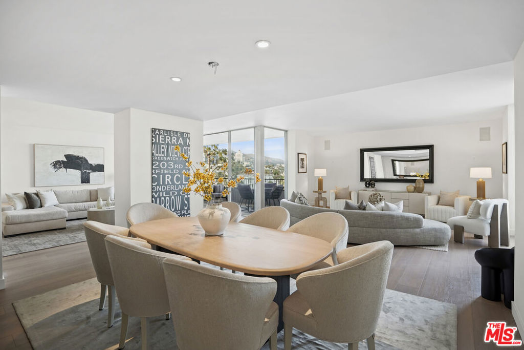 Welcome to Residence 904 at Empire West, a spacious and light-filled 2-bedroom, 2.5-bath home in one of West Hollywood's most prestigious full-service buildings. Perched high above the city, this beautifully maintained residence offers generous scale, sweeping views, and a seamless layout ideal for both daily living and stylish entertaining. The open-concept living and dining area has floor-to-ceiling glass sliding doors, spilling onto a private terrace with breathtaking city and sunset vistas. The kitchen and bathrooms feature classic, well-kept finishes with enduring appeal. The expansive primary suite includes custom closets, a peaceful en-suite bath with a separate tub and shower, and a private office nook perfect for working from home or a quiet retreat. The second en-suite bedroom offers flexibility for guests, creative space, or a den. Both bedrooms enjoy private balconies with stunning views of either the hills, the city or DTLA. Empire West provides white-glove amenities including 24-hour doorman and valet service, a rooftop pool and lounge with panoramic views, a fitness center, and a tennis court. Moments from the Sunset Strip, residents enjoy the best of West Hollywood living in an iconic, full-service setting.