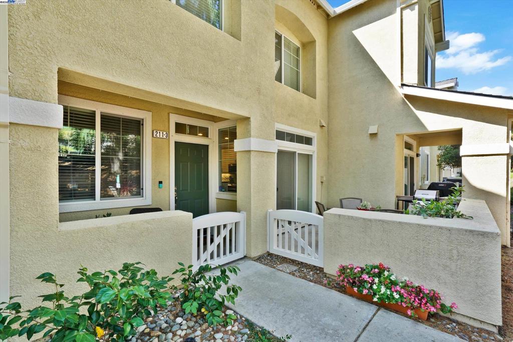 Step into modern elegance in this updated 2 bedroom, 2 ensuite and a half bath downstairs condo. Boasting 1213 sq ft of open concept living space nestled in the secure gated community of Copper Hill. With pool, spa, playground and tennis courts! Newer carpeting upstairs, new laminate flooring downstairs, a beautiful remodeled kitchen, new appliances, granite counter tops, shaker cabinets and a center island. New paint, LED lighting, in ceiling speakers, extra canned lighting, and a beautiful gas fireplace. Garage has a level 2 EV outlet. Located minutes from restaurants , shopping, 580 freeway, the local downtown and the farmers market. It's everything you need for comfortable, convenient living. Whether you are a first time buyer, downsizing or seeking tranquil living, this is the home for you. Come take a peek and see for yourself. Gate will be open this weekend, so. come take a peek.