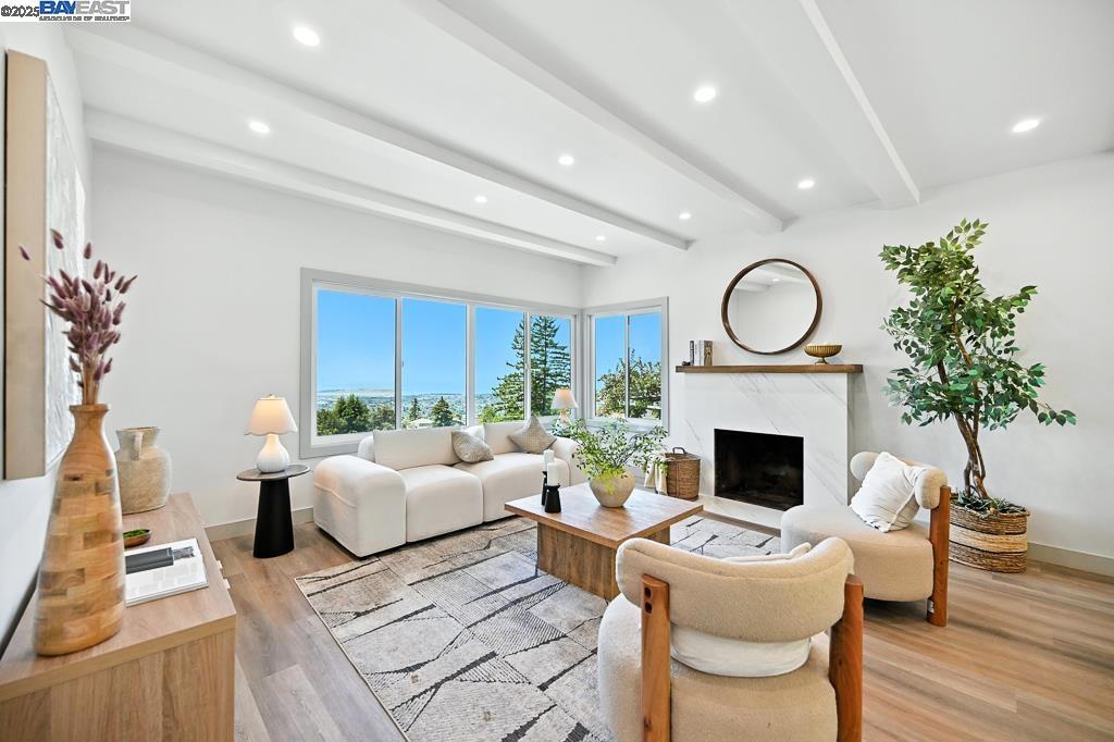 Welcome to 411 Vassar Ave, a beautifully remodeled gem nestled in the coveted Berkeley Hills. This sun-filled home offers breathtaking panoramic views of the Bay from the living room and two spacious bedrooms—perfect for enjoying sunsets and city lights right from your own home. The open-concept living space features modern finishes, a sleek updated kitchen, and seamless flow to an expansive deck—ideal for relaxing, entertaining, or soaking in the spectacular scenery. The lower-level unit includes a private entrance, one bedroom, a full bath, and versatile space—perfect as a guest suite, in-law unit, or potential rental for added income. Additional features include a 2-car carport and a peaceful, elevated setting just minutes from Tilden Park, UC Berkeley, and the vibrant Gourmet Ghetto. Don’t miss this rare opportunity to own a move-in-ready home with unmatched views and flexible living options in one of Berkeley’s most desirable neighborhoods. OH 8/10 2-4pm