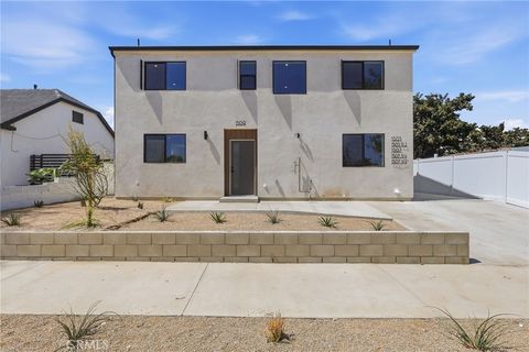 Photo of 1507 W 83rd Street, Los Angeles, CA 90047 (MLS # SB26148860)