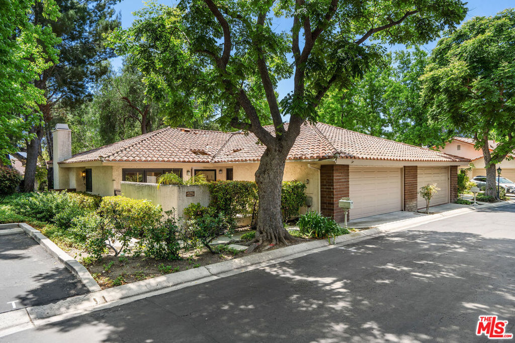 Bring All Offers! Sellers Are Motivated! Welcome to 4042 Stoneriver Court, a beautifully updated single-story end-unit home tucked away in the tranquil and tree-lined Northgate community of Westlake Village. From the moment you arrive, you'll feel the sense of calm and comfort that this peaceful enclave offers. Whether you're coming home from a long day or enjoying a slow morning with a cup of coffee on your private patio, this is a place where life feels a little more relaxed, a little more inspired. Offering 3 spacious bedrooms and 2 bathrooms across 1,567 sq ft, this home features a thoughtfully upgraded interior designed for both style and ease of living. The remodeled kitchen is a chef's dream, complete with Caesarstone countertops, a Blanco Silgranit sink, Grohe faucet, Viking range, stainless steel Electrolux refrigerator, and Miele dishwasher. Engineered Hickory hardwood flooring flows throughout, complemented by plush wool carpeting in just the right places. Soaring cathedral ceilings, abundant natural light from skylights, and a modernized fireplace with Ebony glass and a new screen set the tone for welcoming gatherings or quiet evenings at home. The dual-sided carved Mahogany front door with stained glass adds a touch of timeless elegance. This home has been thoughtfully upgraded for comfort and efficiency, including a 4-ton Lennox furnace and A/C system with new ductwork (2017), a Rinnai tankless water heater, iComfort WiFi thermostat, and dual-glazed Milgard windows. The attached two-car garage features a newer garage door and opener for added convenience. Outside, enjoy a stamped concrete patio with drought-tolerant, pet-friendly Synlawn perfect for morning meditation, weekend BBQs, or simply soaking in the fresh air and sunshine. This is more than just a home, it's a sanctuary. A place where modern living meets timeless serenity. Just minutes from local parks, shops, restaurants, and with easy access to transit, you'll love the balance of peaceful seclusion and urban convenience. End-unit privacy, beautifully landscaped surroundings, and a lovingly maintained interior make 4042 Stoneriver Court a special place to call your own. Come see it for yourself, this Westlake Village gem is ready to welcome you home.