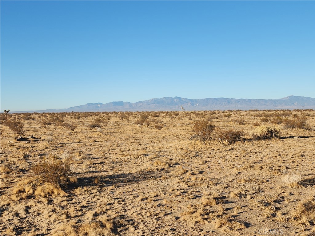 This +/- 2.0 acre parcel is zoned Desert Living (DL2.5) and is approximately less than a half mile just off Hwy 395 within the Adelanto city limits, with solar farms in the area and a trucking company storage lot just two parcels away. It may take some rezoning work with the city, but if you’re looking to store trailers, build a solar farm, build a future home or save it as an investment for the future of Adelanto, either way, this could be the parcel for you. Adelanto is growing by leaps and bounds with multiple housing projects, the legal cannabis industry taking off generating approximately $4.5 million in revenue, and contributing to the city's economic sustainability and growth. And commercial projects with the latest project being built by Lewis Retail Centers on the corner of Mojave Dr & Hwy 395. Hwy 395 is busier than ever, and this is a great area to invest in for the future. All Information is Deemed Reliable, But Not Guaranteed, Buyer and their agent to confirm any and all info including use of the property and any planned projects that you may want to do with it.