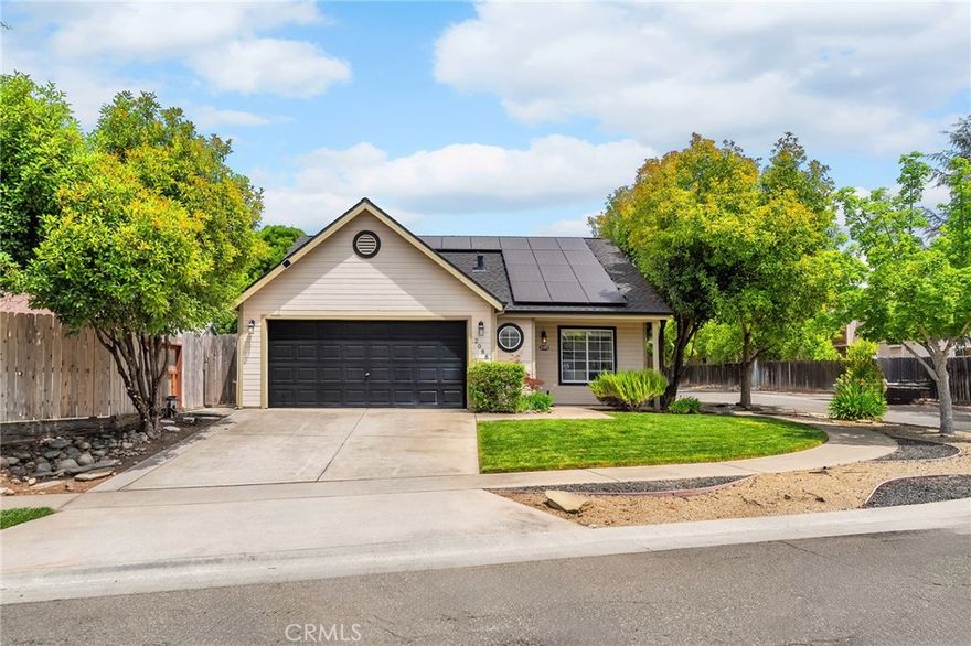 Updated 3 bedroom 2 bathroom South Chico home on a corner lot with OWNED SOLAR and a 2024 roof. Beautiful kitchen with quartz counters, tile backsplash, barstool island, extra cabinetry for storage, granite composite sink and stainless steel appliances. Vaulted ceilings in the living room and primary suite. Interior features include whole house fan, dual pane windows and separate laundry room. The large primary suite has a soaking tub and access to the back yard through a sliding glass door. The screened porch is perfect for year around outdoor gatherings. Fully landscaped and irrigated front and back yards. 2 car garage. Close proximity to shopping and Meriam Park.