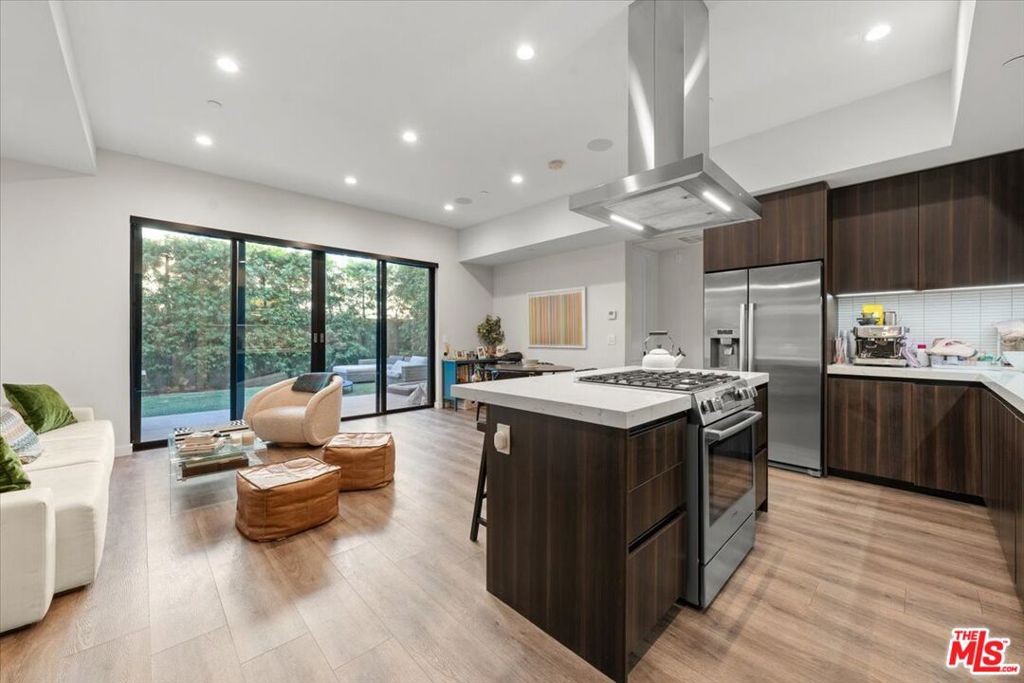 ** 2-CAR ASSIGNED GARAGE PARKING ** LARGE PRIVATE BACKYARD ** PET FRIENDLY ** CENTRAL A/C ** WASHER/DRYER ** Experience the pinnacle of West Hollywood living in this stunning, modern 2-bedroom, 2-bathroom luxury flat. Spanning over 1,100 square feet, this spacious unit is designed for comfort, style, and convenience. Step into the bright, open-concept living area that flows seamlessly into a sleek, fully equipped kitchen featuring top-of-the-line stainless steel appliances, perfect for entertaining or everyday living. The unit offers central AC for year-round comfort and a convenient in-unit washer and dryer. The primary suite is a true retreat with a spa-like bathroom and walk-in closet, while the secondary bedroom and bathroom provide both privacy and functionality. A rare highlight of this home is the expansive private backyard, offering the ultimate outdoor oasis for dining al fresco, hosting gatherings, or simply relaxing in your own secluded retreat. The yard also includes a convenient storage nook, perfect for keeping bikes, outdoor gear, or seasonal items neatly tucked away. The residence is pet-friendly, with plenty of room for your furry companions to play and enjoy the outdoors right at home. Parking is never a concern with two private, covered spaces included, a true luxury in the heart of West Hollywood. Nestled in a highly sought-after location, you're just moments away from trendy boutiques, fine dining, and vibrant nightlife. This beautiful, move-in ready unit is a rare find in a prime neighborhood perfect for those seeking upscale, pet-friendly living in one of LA's most desirable areas. Tenant pays utilities.