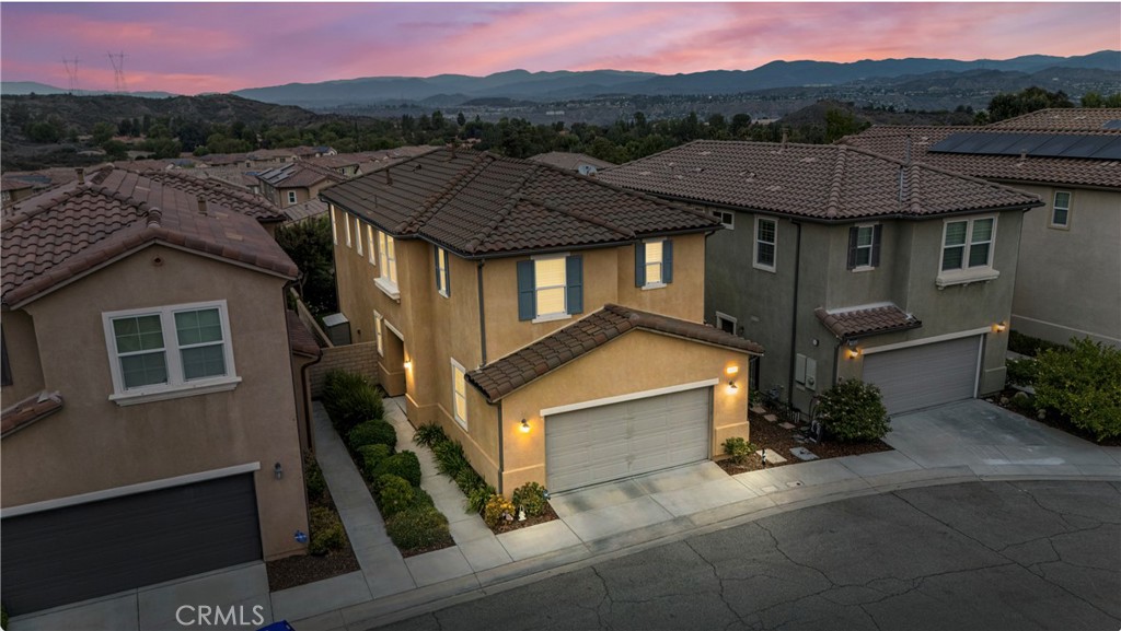 Rare opportunity in Valle Di Oro—this small GATED enclave rarely sees homes come available. Immaculate and move-in ready 3 Bedroom + Loft, this upgraded original-owner property offers spacious rooms, stunning finishes, and sunsets views.
The heart of the home is the stunning designer kitchen with white granite, custom backsplash, huge walk-in pantry and a large island that flows to the great room and dining area—ideal for entertaining. Step outside to your private retreat with hot tub and pergola for year-round enjoyment.
Upstairs, enjoy a flexible loft space (easily converted to 4th bedroom) with built-in office, oversized secondary bedrooms, bathroom and an oversized primary retreat with generous sitting area, spa-style bath, and unforgettable mountain and sunsets views.
Living in Santa Clarita offers a relaxed pace with highly regarded schools, miles of trails and open space, family-friendly amenities, and everyday conveniences just minutes away - Costco, Trader Joes, Target, restaurants and Highways. Add in a low HOA of just $194 and no Mello Roos, and this home combines comfort, value, and lifestyle in one rare package.
In a market where opportunities are rare, this one won’t last—don’t wait.