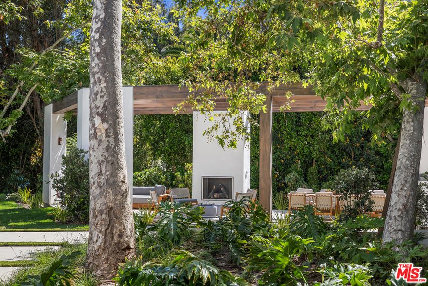 Stunning, serene, bold, and impossible-to-duplicate brand new construction Brentwood estate. Privately sited off of Mandeville on quiet Shadow Canyon Road on a remarkable, nearly flat acre protected reserve of Live Oaks and majestic coastal Sycamores, some over 100 years old. From masterful ANR Signature Collection with MasaStudio--the designers of Amangiri resort in Utah, the most exclusive getaway in America. More than 12,000 square feet thoughtfully placed above grade, with disappearing electrified Fleetwood doors, enveloping the spacious home in harmony with nature and golden light. One of the most inspired, Zen, and beautiful owners' suite bathrooms ever designed in Los Angeles. Attached 3-bedroom guesthouse doubles as Captain of Industry production office. Hollywood-chic screening room jewel with glamorous blue velvet walls. Gallery walls for modern art, expansive hotel-sized Cantera stone patio overlooking sparkling saltwater 48-foot swimmers pool w/spa. Magical outdoor cabana destination for entertaining w/fireplace & kitchen. Elevator, gym/Pilates studio w/steam shower, wine room, double-height 3-car garage, separate 4th staff garage, staff/security office, service entrance, add'l prep kitchens, Savant A/V & security. Potentially many years before another property of equivalent modern elegance, privacy, and artful refinement comes to Brentwood.