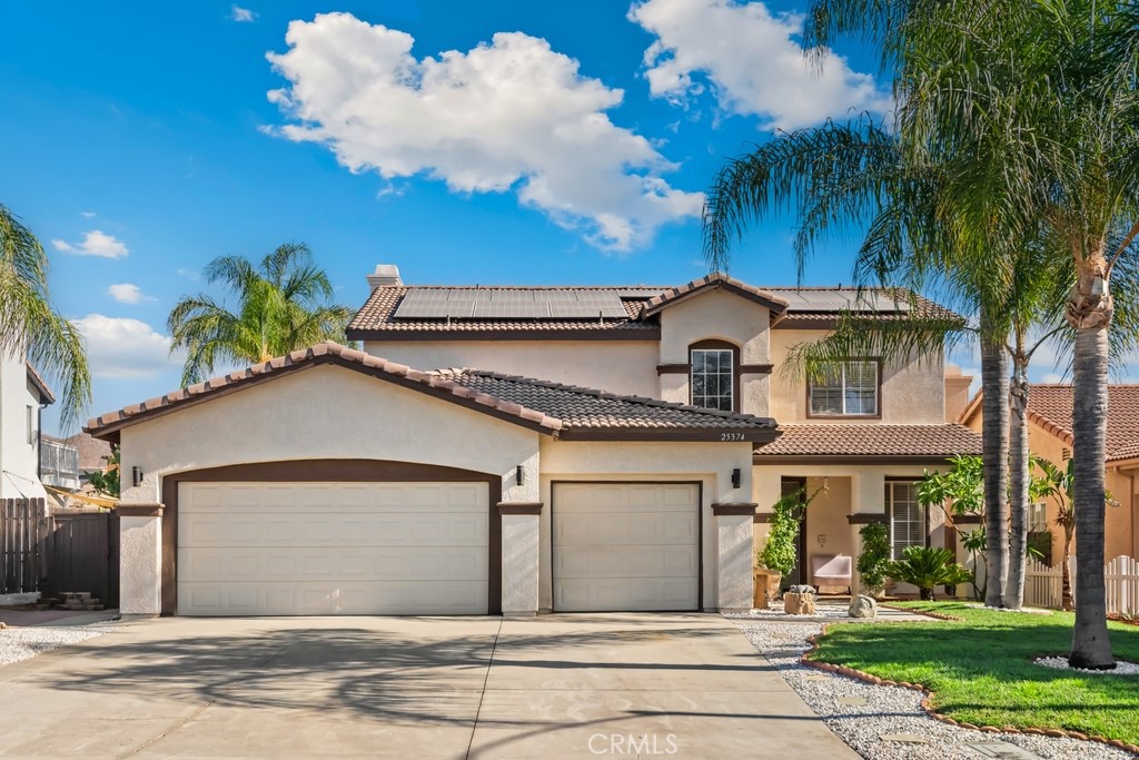 Welcome home! Menifee beauty loaded with 5 bedrooms and palm tree-lined pool/spa. Spacious and bright, this home has been well maintained and is ready for its new family. Close to everything and low tax, no HOA. Good sized backyard with budding orchard area (peach, apricot, orange, plum, lemon, grape), whole house fan, whole house water softener, 3 car garage, no carpet-a plus for allergens-tile downstairs, laminate upstairs, Alumawood patio cover in backyard, newer AC and water heater, epoxy floor in garage, excellent curb appeal.