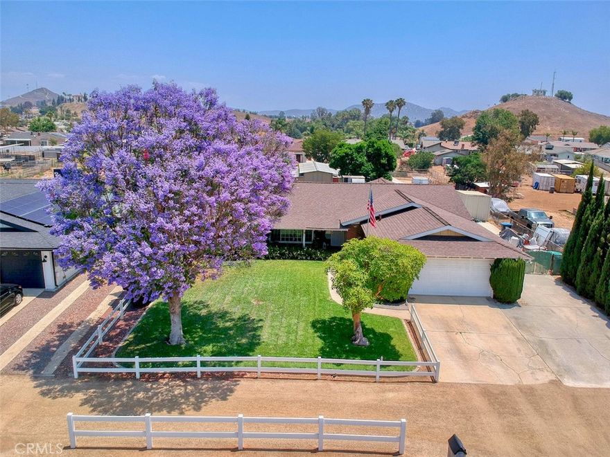 Iconic horse property located in The Bluffs at the heart of Norco. Charming ranch home highlighted by brick accents and lush landscaping. Recently updated kitchen has white cabinets, quartz counters and emphasized by travertine tile backsplash. Double oven and 5 burner gas stove is a gourmet chefs dream. Additional cabinets make storage in the kitchen a breeze. Expansive family room features a wood burning stone fireplace and plenty of space to spread out. Your new backyard has endless possibilities for enjoying the SoCAL weather. A large covered patio for entertaining opens to a garden,  spacious lawn, and horse stables for horse back riding. The barn offers 4 stalls, with 6 foot stud rail corrals with an attached enclosed tack shed. 

The property is sided by two horse trails for easy access. Side driveway extends back to the barn and allows for RV or boat parking. Situated between the 91 and 15 freeways you feel rural but very close to shopping, entertainment, schools and services. Please call for a private tour of this beautiful home.