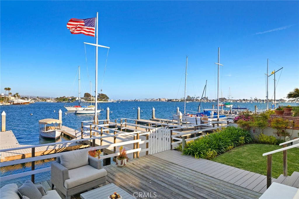 Rare opportunity to lease short term on the bayfront (30 day minimum) in the private, resort lifestyle, gate guarded community of Bayshores. Landlord will consider long term lease beginning 01/2026. This is the ideal coastal retreat. Classic Bayshores two story home with bay fronting patio, lawn and private dock. Situated just a few doors to Bayshores swim beach & sand volleyball. 4 bedrooms total, family and living rooms, bay fronting master suite with adjacent sitting room/den. Lots of old school charm here! Completely furnished and outfitted. This is a rare opportunity!