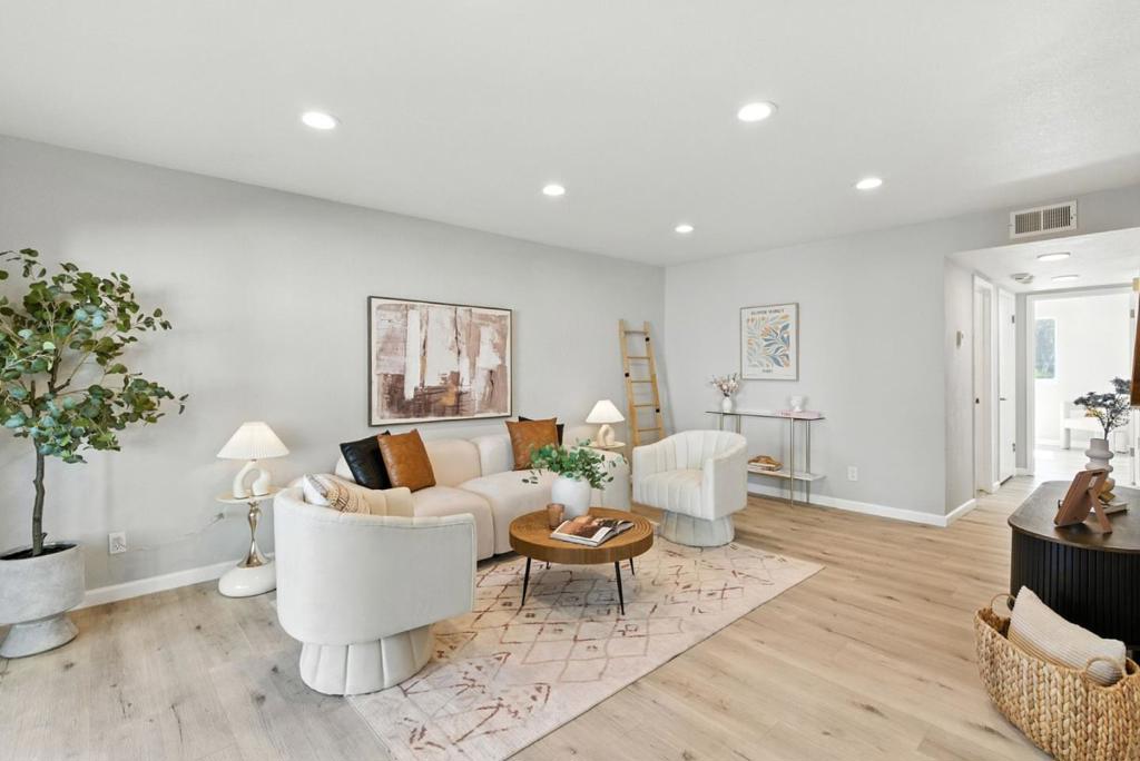 Welcome to this beautifully updated first-floor, 2-bedroom condo in the highly sought-after Parkview West community. Surrounded by lush landscaping, mature trees, and peaceful walking paths, this home offers resort-style amenities including two swimming pools, a hot tub, fitness room, clubhouse, and abundant guest parking. Inside, the open living and dining area features new hard-surface flooring, recessed lighting, and large sliding doors leading to a spacious private patioperfect for relaxing or entertaining. The modern kitchen and bathroom were fully renovated in 2022 with quality finishes. Rarely found in condos, the seller has added extra insulation, providing year-round comfort, energy efficiency, and noise reduction. Additional features include an assigned carport with a large private storage unit and an unbeatable location just steps from Rengstorff Park, Mountain View Community Center and Magic Bridge. Enjoy easy access to Central Expressway, Highway 101, and Caltrain, plus minutes to Whole Foods, San Antonio Center, downtown Mountain View, major tech campuses, and highly regarded Los Altos High School. Move-in ready and perfectly situated, this home blends modern style, thoughtful upgrades, and exceptional convenience.