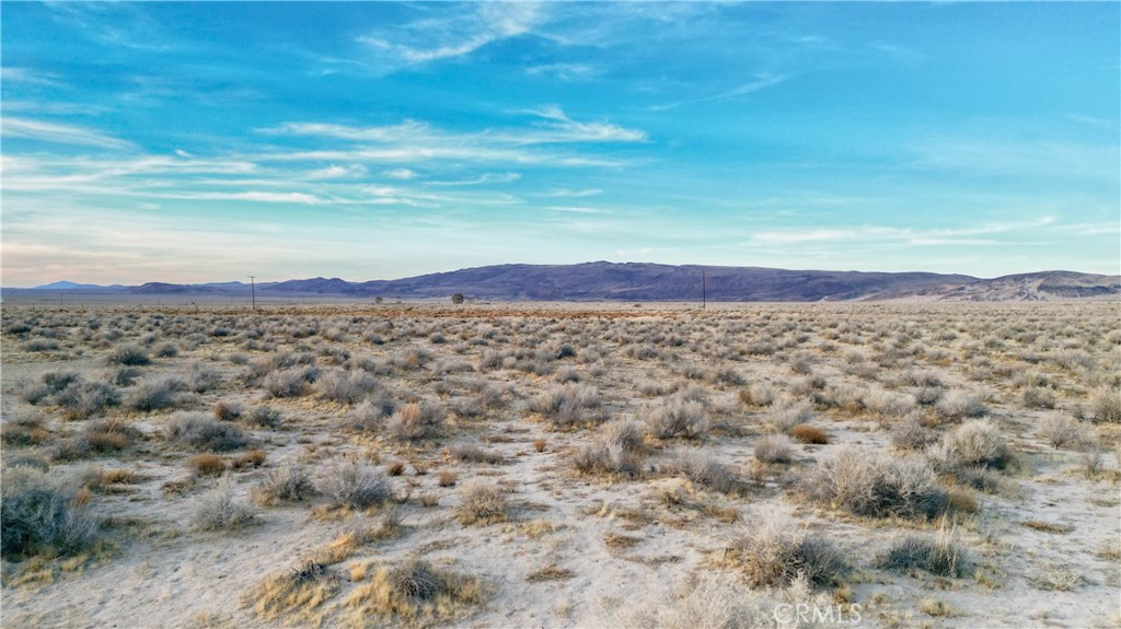 Endless possibilities await with this expansive 40-acre parcel located in the peaceful desert community of Hinkley, California. This flat, usable land offers the perfect opportunity to build your custom home, develop an off-grid retreat, or hold as a long-term investment.
Situated in a serene and private setting with stunning panoramic desert and mountain views, this property provides the ideal canvas for your vision. Zoned for Rural Living (RL), the lot supports a variety of residential and agricultural uses. With ample space and privacy, this is a rare opportunity to own a large piece of land at an incredible value.
Whether you’re looking to create a personal oasis, recreational getaway, or develop for future potential — this property has it all.
Key Features:
• Lot Size: 40 Acres (1,742,400 sq ft)
• Zoning: Rural Living (Buyer to verify)
• Utilities: No utilities on site (ideal for off-grid use)
• Topography: Level, unimproved
• Views: Desert, mountains, and wide-open skies
• Access: Dirt road access (Buyer to verify)
Buyer to verify all zoning, usage, and utility availability with the County of San Bernardino.
Don’t miss this chance to own a piece of the High Desert and build your dream from the ground up!