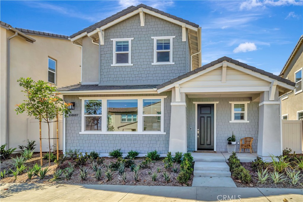 This beautifully crafted, fully furnished new-construction two-story home offers 4 spacious bedrooms and 3.5 bathrooms, seamlessly blending modern comfort with thoughtful design. The first floor features an open, light-filled layout with numerous windows that create a bright and welcoming atmosphere. At the heart of the home is a chef’s dream kitchen, complete with built-in appliances, a large island with seating, a fully functional setup, and a separate dining area ideal for both everyday living and entertaining. Also on the main level are a convenient half bath for guests and a full primary bedroom with a private en-suite bathroom. Upstairs, the home continues to impress with two additional bedrooms sharing a full bathroom, a generous laundry room equipped with a brand-new washer and dryer, and a spacious open family/playroom. A second, massive primary suite on this level includes a dedicated gym area, a spa-inspired bathroom with a soaking tub, separate standing shower, double vanity, and a large walk-in closet. Outside, the paved side yard offers a shaded sitting area and low-maintenance, drought-tolerant landscaping. Additional highlights include a two-car garage, solar power for energy efficiency, and access to a community pool and spa just five minutes away. Linens and towels are provided, and a cleaning crew will service the home twice a month for added convenience.