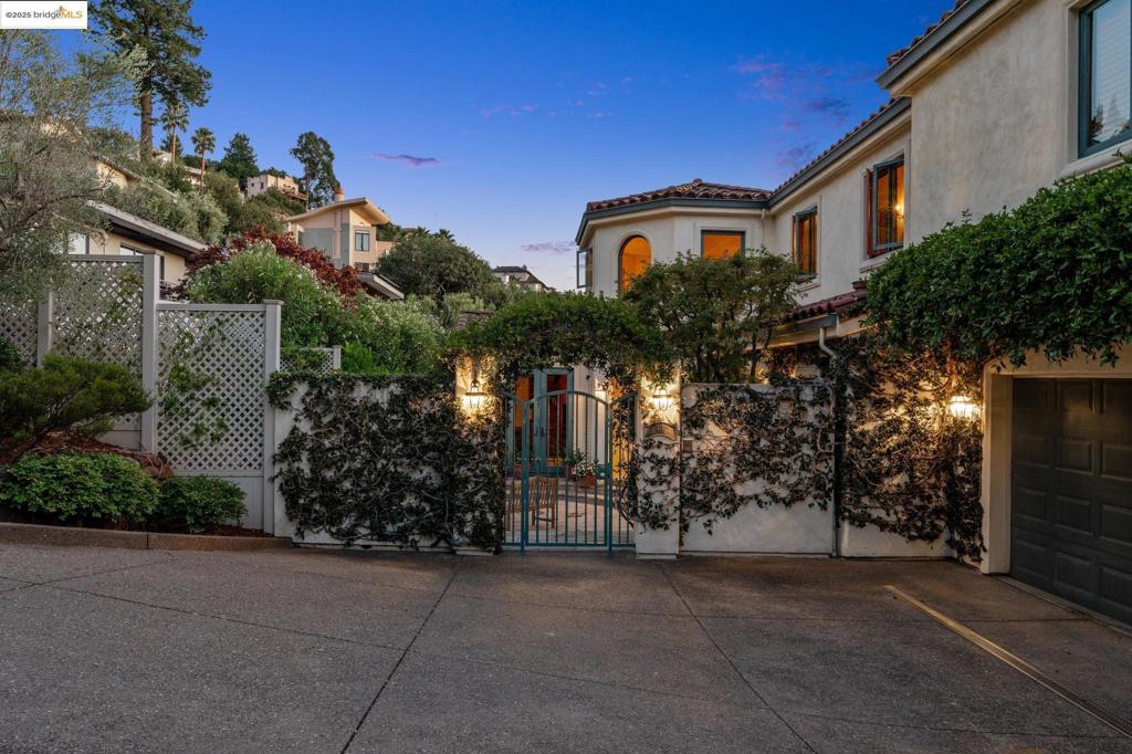 Welcome to 29 Live Oak Road, an elegant retreat nestled in the Claremont Knolls part of Berkeley*. This exquisite residence offers 2,944 square feet of refined living space on an expansive 20,898 square foot lot. The home boasts four generously-sized bedrooms, including a sumptuous primary suite, and two and a half beautifully appointed bathrooms. A separate office provides a tranquil space for work or study. The large chef's kitchen is a culinary enthusiast's dream, seamlessly flowing into the family room as a great room, perfect for both intimate gatherings and grand entertaining. A formal dining room and a large sunken living room offer sophisticated spaces for hosting, while access to gorgeous decks invites you to enjoy breathtaking views from every rear-facing window. Step outside to a large front patio or explore the large lot that elegantly cuts through to Westview below. An enormous 2+ car garage ensures ample storage and convenience. Discover the perfect blend of elegance and comfort at 29 Live Oak Road, where every detail has been thoughtfully curated for an unparalleled living experience. Close to the famed Claremont Resort and Spa, Montclair, Elmwood shopping district, and easy commute options to SF or Contra Costa. Beautifully situated for life on a grand scale.