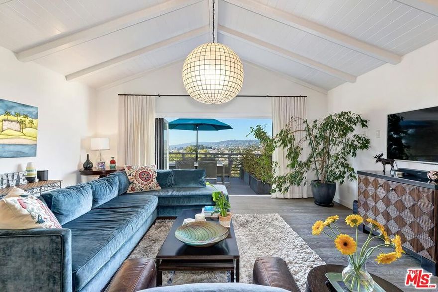 Situated in the tranquil hills above Los Feliz, is a serene hillside sanctuary where timeless charm meets modern livability. Located in the sought-after Franklin Hills enclave, this thoughtfully designed residence captures sweeping panoramic vistasfrom the iconic Griffith Observatory across the shimmering city skylineinfusing every room with natural light and a profound sense of openness.The grounds are equally captivating, enveloped by mature landscaping that creates a lush sense of privacy. Plumeria perfumes the air, a vibrant crape myrtle brings seasonal color, and a stately magnolia adds year-round elegance. These carefully curated plantings frame the terraces and patios, setting the scene for morning coffee among the trees, alfresco dinners with city views, or quiet evenings spent beneath the stars.Inside, the home balances original architectural character with refined modern updates. Three spacious en-suite bedrooms plus a powder room provide comfort and functionality, while hardwood floors, custom finishes, and expansive windows create a warm, inviting ambiance. The effortless indoor/outdoor flow anchors the quintessential Southern California lifestyle, with private terraces and garden-view rooms that blur the line between home and nature. Beyond the property, the Franklin Hills neighborhood is rich in character, creativity, and architectural diversity from Spanish Revival gems to Mid-Century Modern retreats tucked along winding streets shaded by mature trees. Moments from the best of Los Feliz Village and Silver Lake, residents enjoy access to acclaimed cafes, boutiques, markets, and beloved cultural landmarks. Whether exploring nearby parks, hiking Griffith Park's iconic trails, or experiencing a live performance at the Greek Theatre, this home places you at the center of one of Los Angeles' most coveted and vibrant lifestyles.